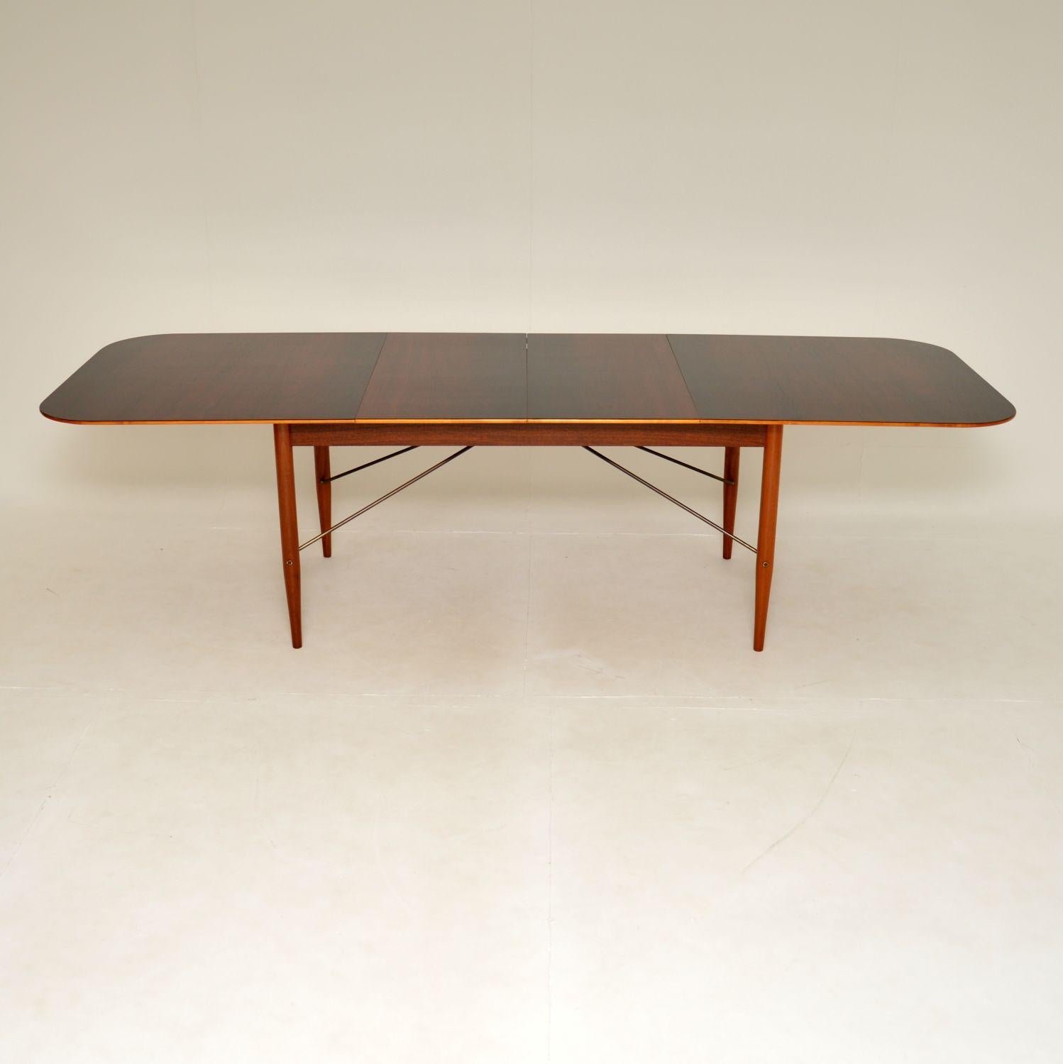 A stunning and extremely rare 1950’s dining table designed by Robin Day for Hille as part of the “Albermarle” range.

The quality is outstanding, this is beautifully made. There are two leaves that come with this so when fully opened, it is enormous