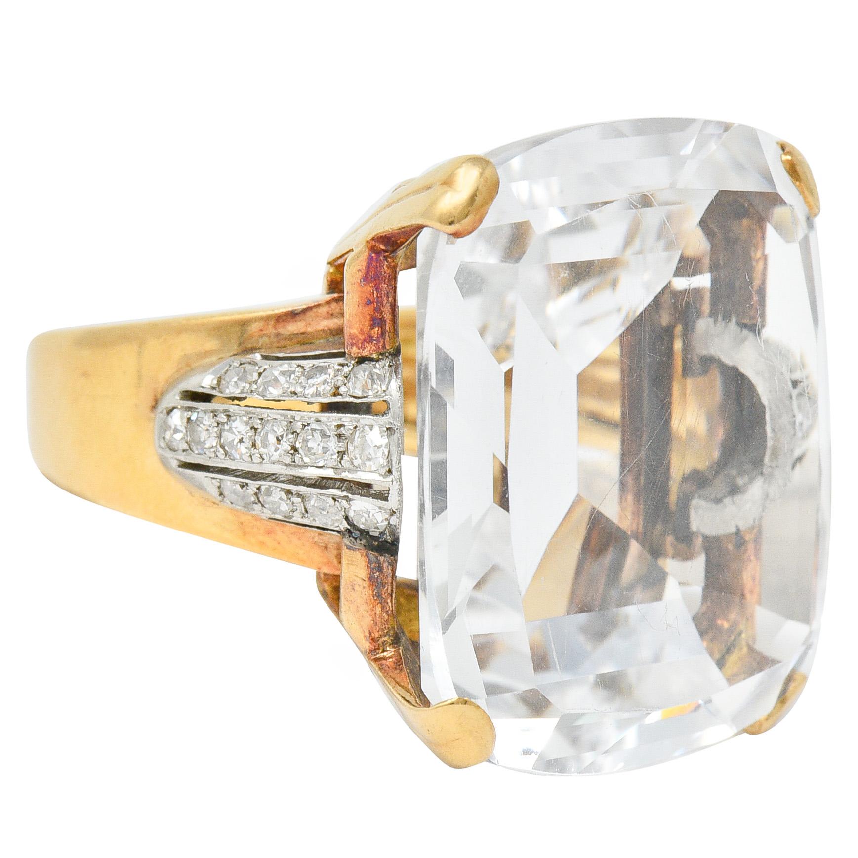 Centering a large rectangular cushion cut rock crystal quartz; transparent and colorless

Basket set and flanked by puffed white gold shoulders bead set with old single cut diamonds

Weighing in total approximately 0.70 carat with G/H color with SI