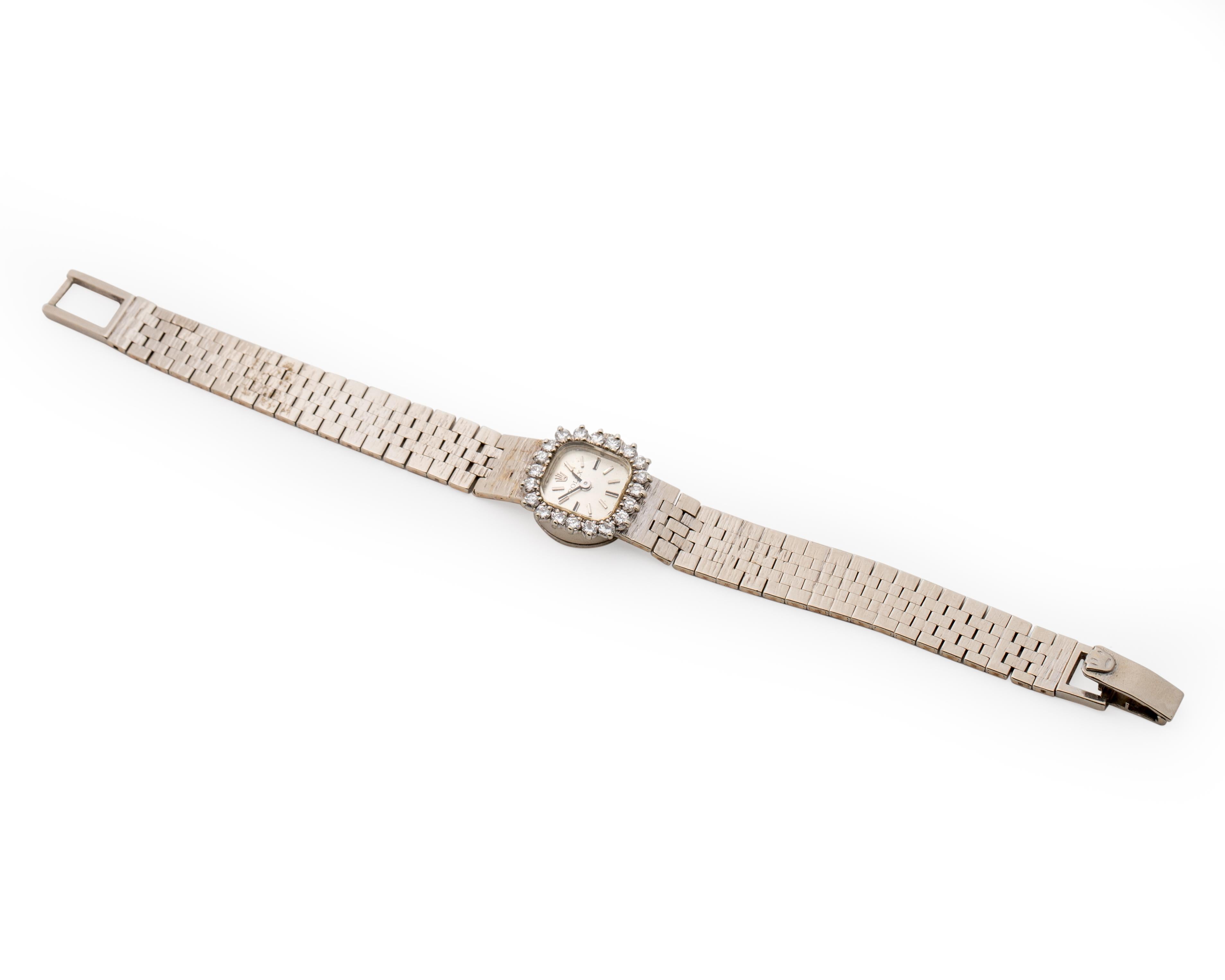 Item Details:
Metal type: 14 Karat White Gold
Weight: 25 grams
Measures: 7 Inch Bracelet 

Watch Details:
Womens Wristwatch
Dainty yet chic 
1950s
Florentine finish on the bracelet 
The watch features a diamond halo with . 35 carats of diamonds