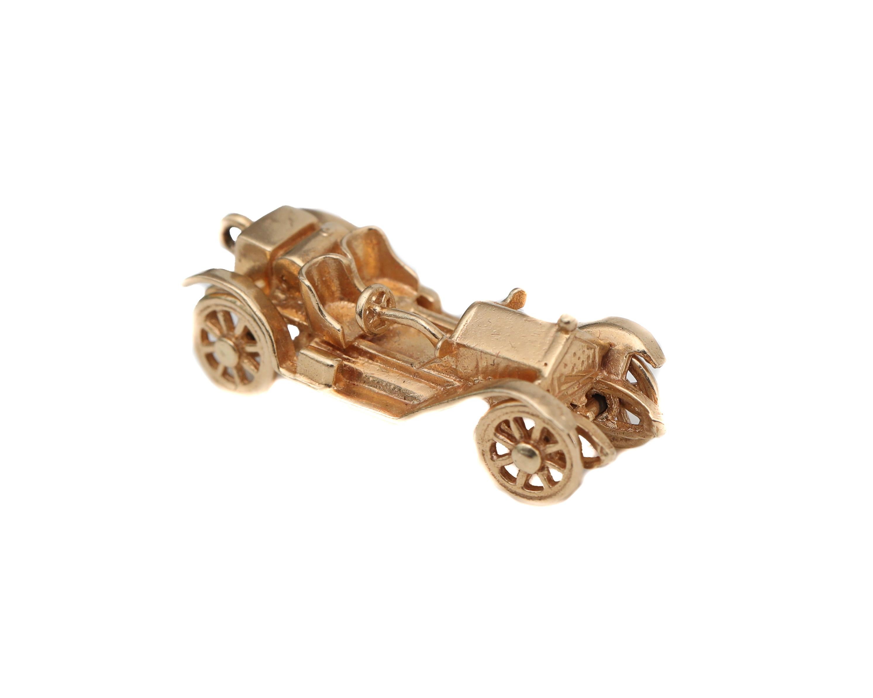 Adorable Rolls Royce Style Car Charm from the 1950s
Vintage car with vintage detailing 
Crafted in 14 Karat Yellow Gold
Every feature and accessory on the car is extremely well made. All 4 wheels on the car move easily. 

Wear it on a bracelet as a
