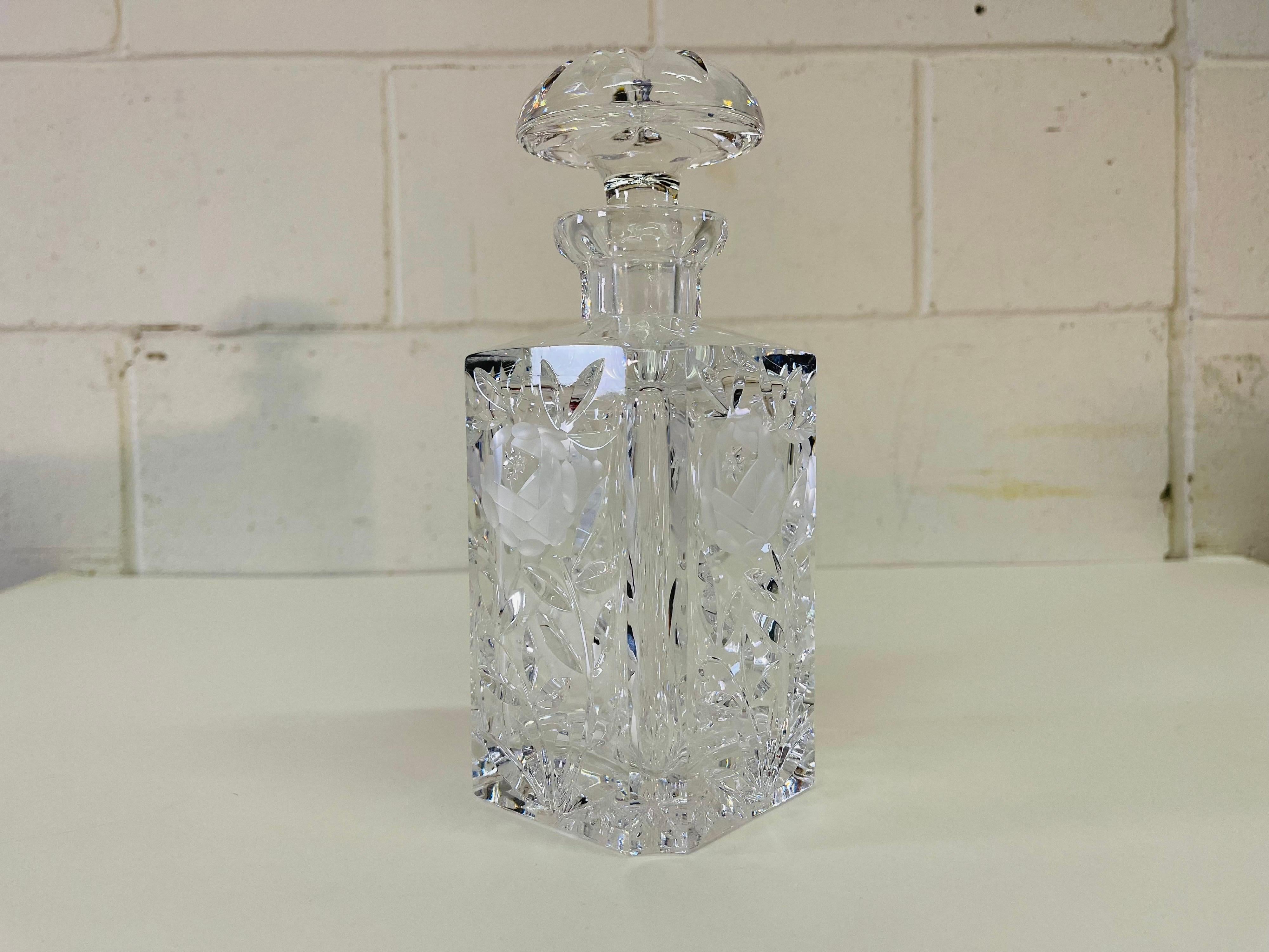 Vintage 1950s square glass decanter with a rose pattern. The decanter is a heavy crystal and is well designed glass. No marks.