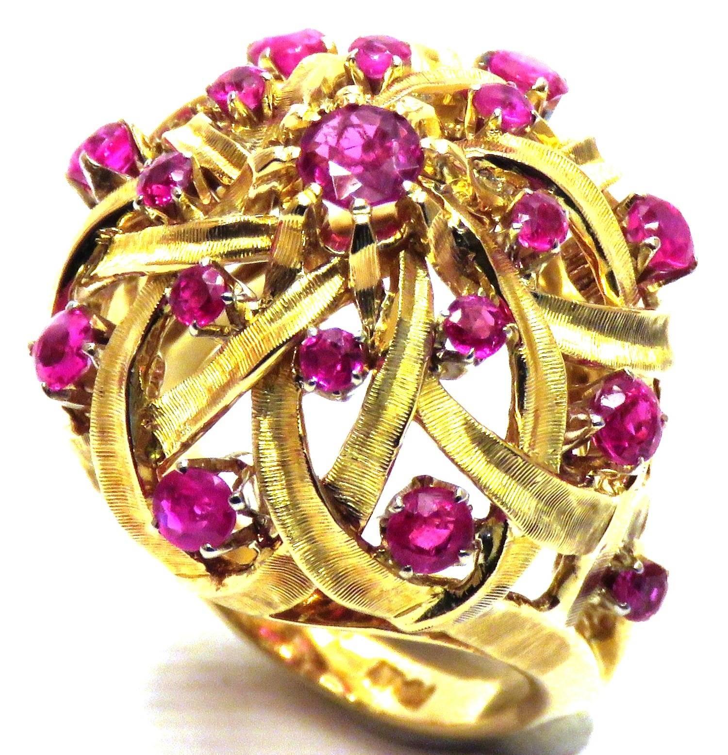 An astonishing style bombe ring in solid 18K yellow gold dating to the early 1950s handmade in Italy.
This intricately designed solid gold ring is entirely hand carved. The detail is astonishing. It is a spectacular piece with natural rubies 1.21