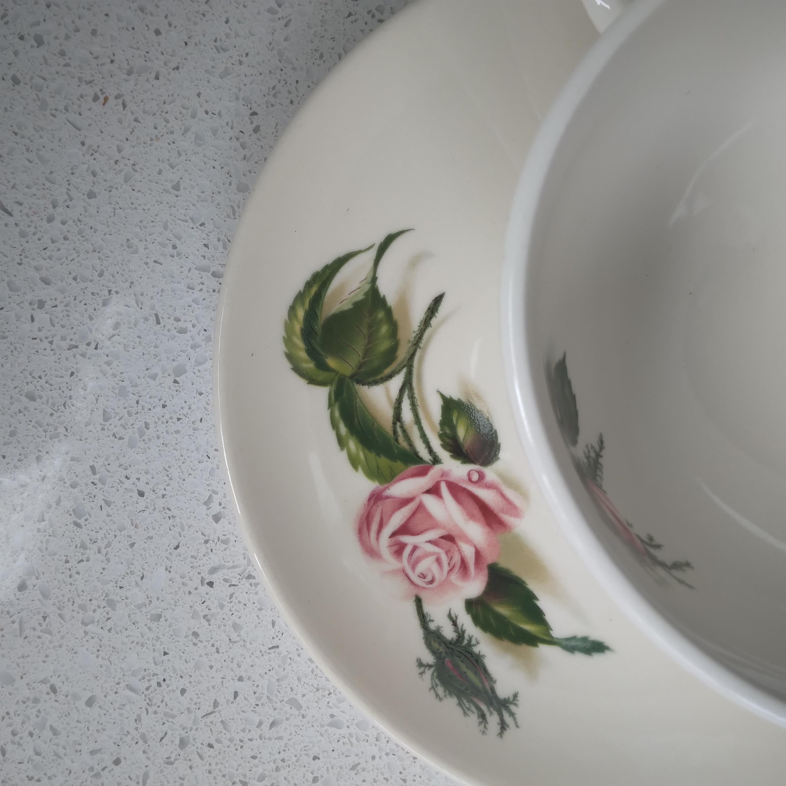 Adorably vintage, this rose garden inspired tea set is pretty and enduring.

In the early 1950s, Universal Pottery debuted their Ballerina line - an elegant and graceful dishware collection that came in a variety of designer solids and florals so