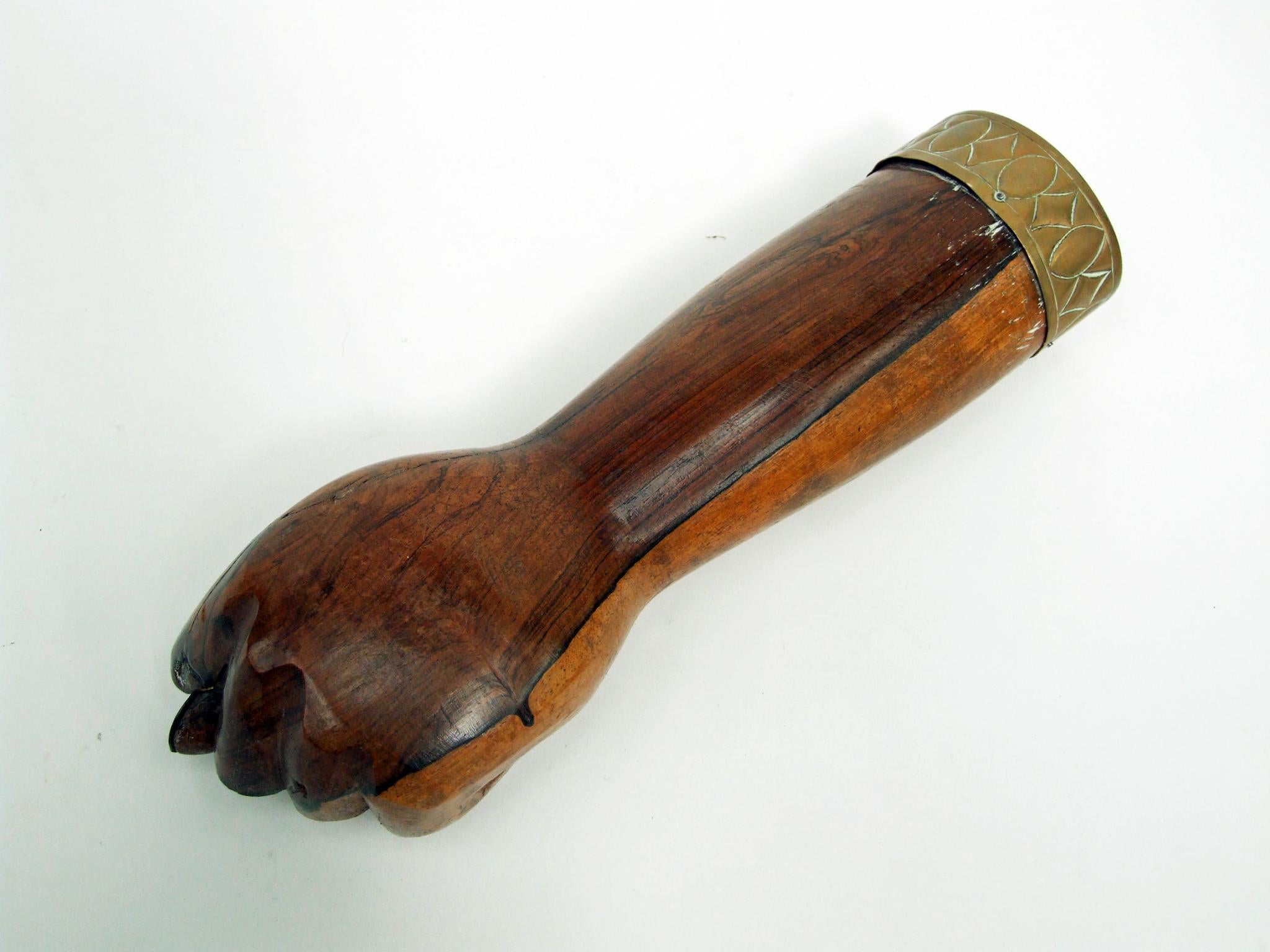 1950s Figa fist sculpture designed and manufactured in Brazil.

Hand carved solid rosewood fist design with brass detail.

Measures: H 6cm x L 28cm x W 7.5cm.