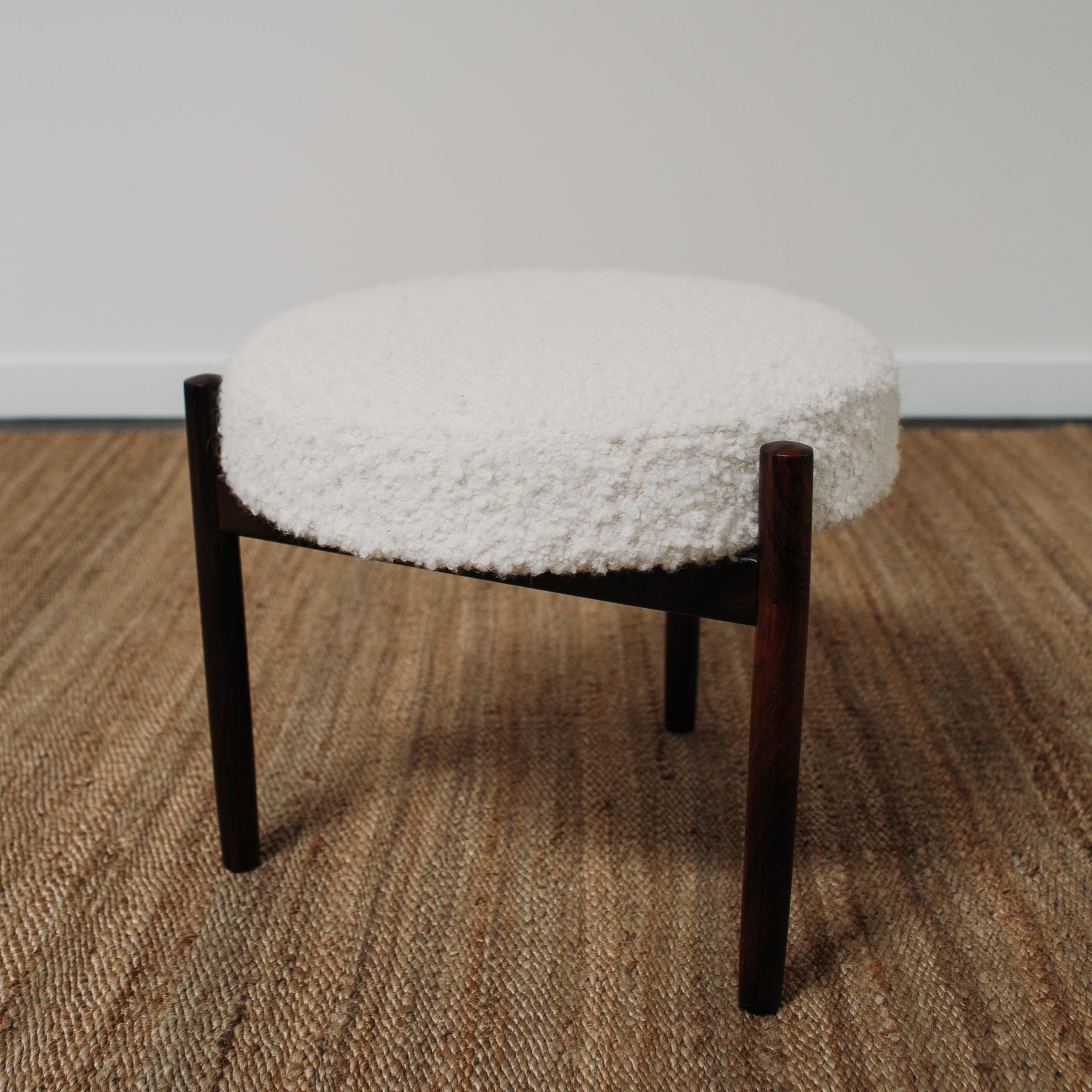 A Danish stool by Hugo Frandsen made from rosewood and reupholstered by The Selby House in a Nobilis Wood Boucle. The frame has also been restored and refinished.