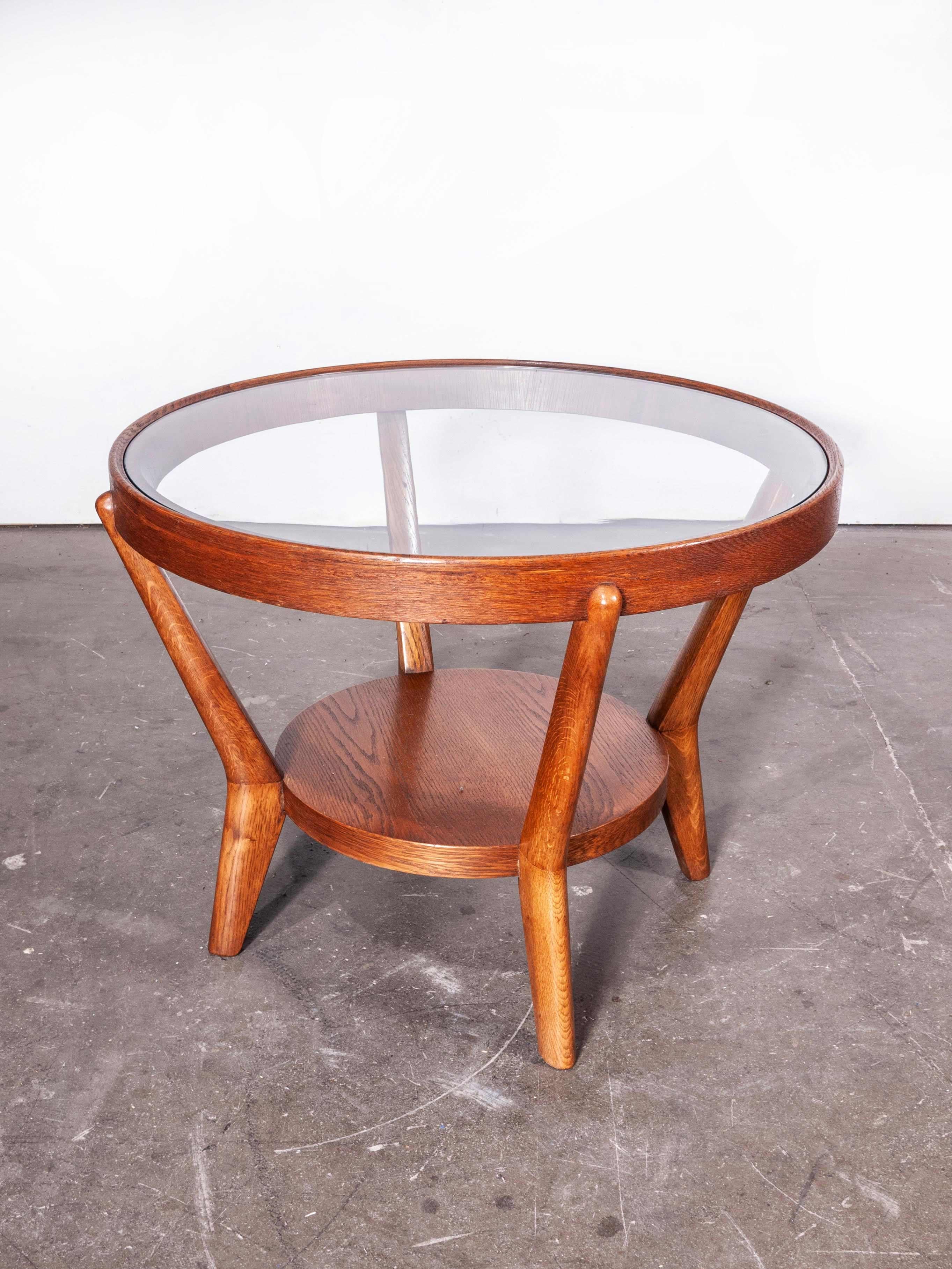 1950s round occasional table by Kozelka and Kropacek for Interieur Praha, warm oak
1950s round occasional table by Kozelka and Kropacek for Interieur Praha. A beautifully proportioned table made from European oak retaining its original glass top.