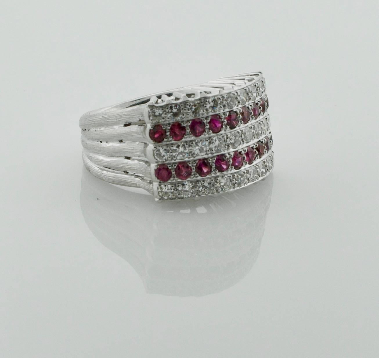 1950's Ruby and Diamond  Five Row Ring in White Gold
Eighteen Round Rubies weighing .55 carats approximately  (bright with no imperfections visible to the naked eye)
Twenty Seven Round Brilliant Cut Diamonds weighing .70 carats approximately (GH