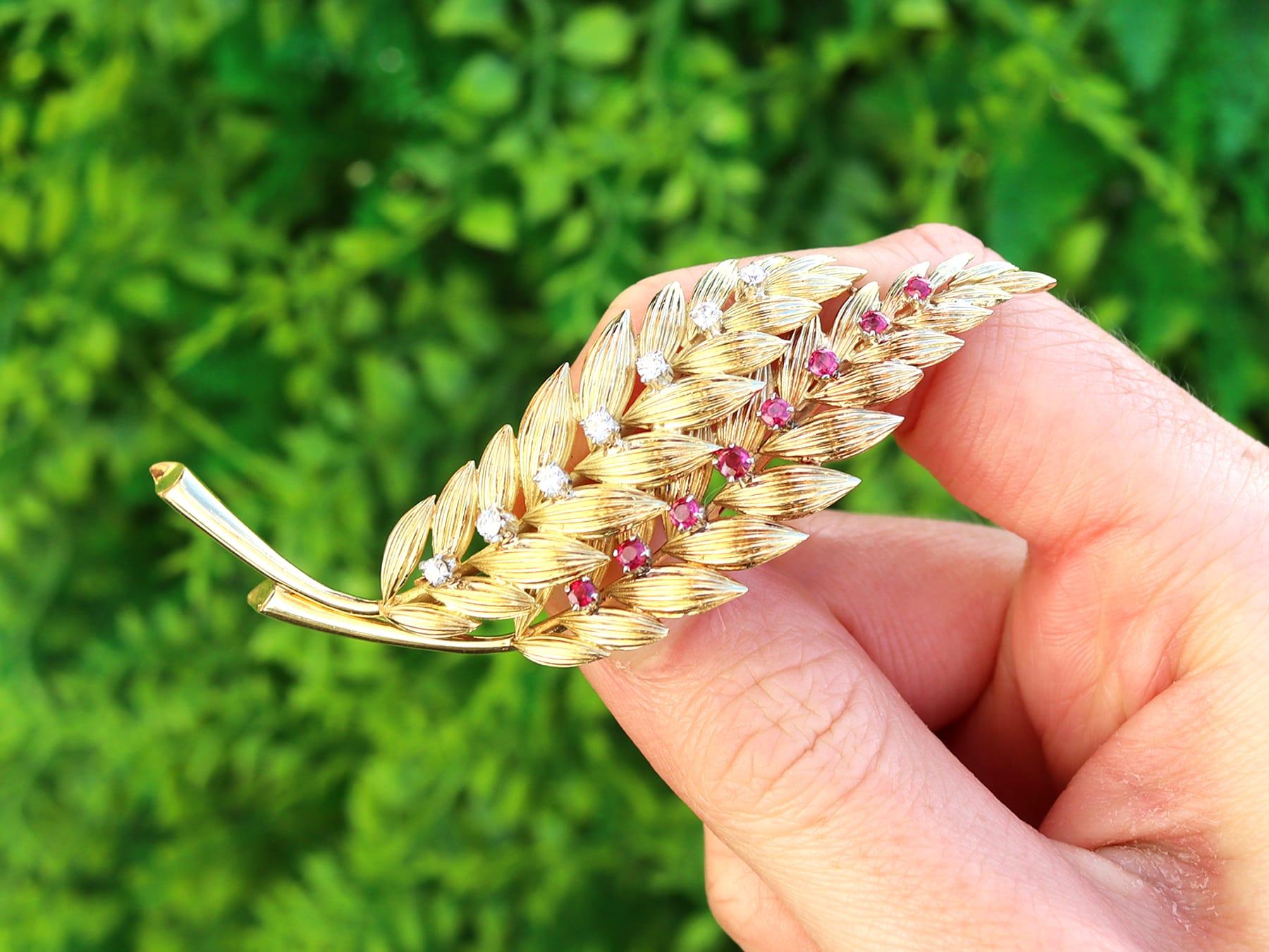 A stunning vintage 0.32 carat ruby and 0.32 carat diamond, 18 karat yellow and white gold 'leaf' brooch; part of our diverse ruby jewelry and estate jewelry collections.

This stunning, fine and impressive gold brooch has been crafted in 18k yellow