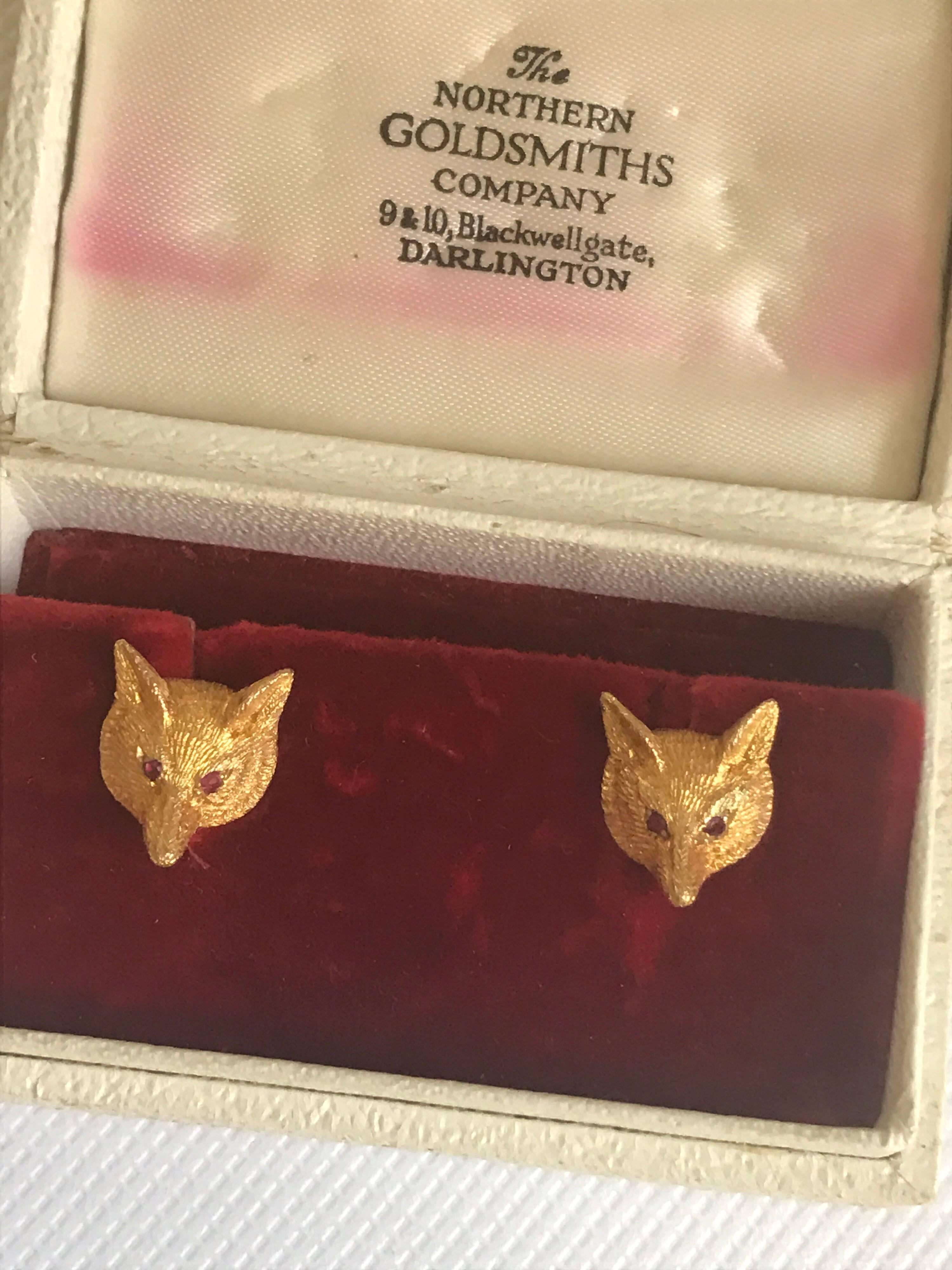 A pair of ruby eyed 1950s fox head earrings set in nine karat gold, hallmarked for birmingham 1957. They are very beautifully designed with very clear detailing and of a heavy weight.  The eyes