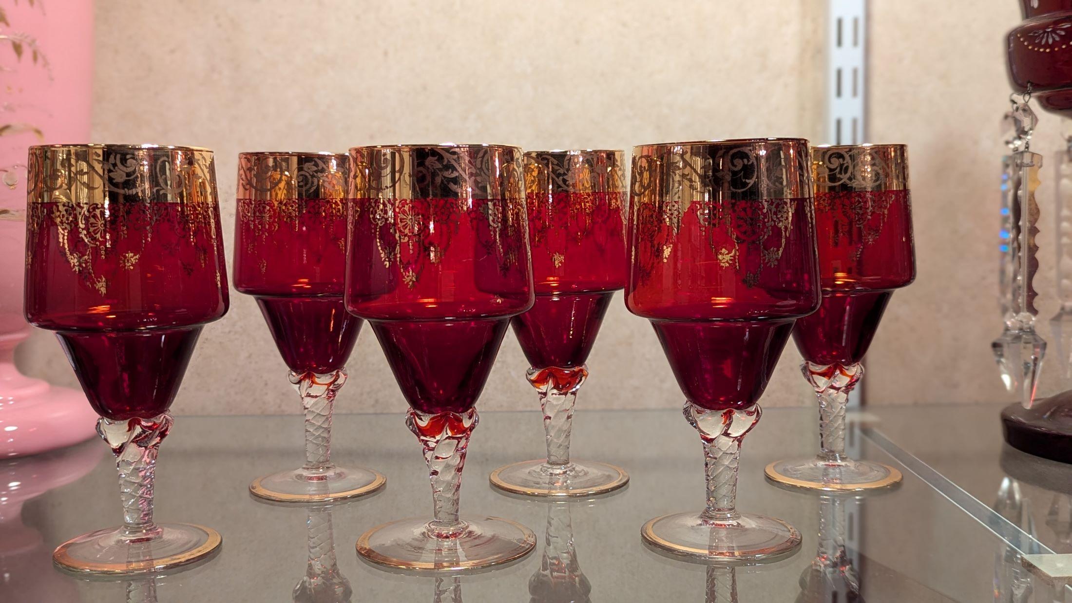 Beautiful set of six ruby red glasses with clear twisted stems and gold overlay, I believe these are Italian made. Quality glass and intricate gold work.  very fine vintage condition, no chips, little to no wear on the gold