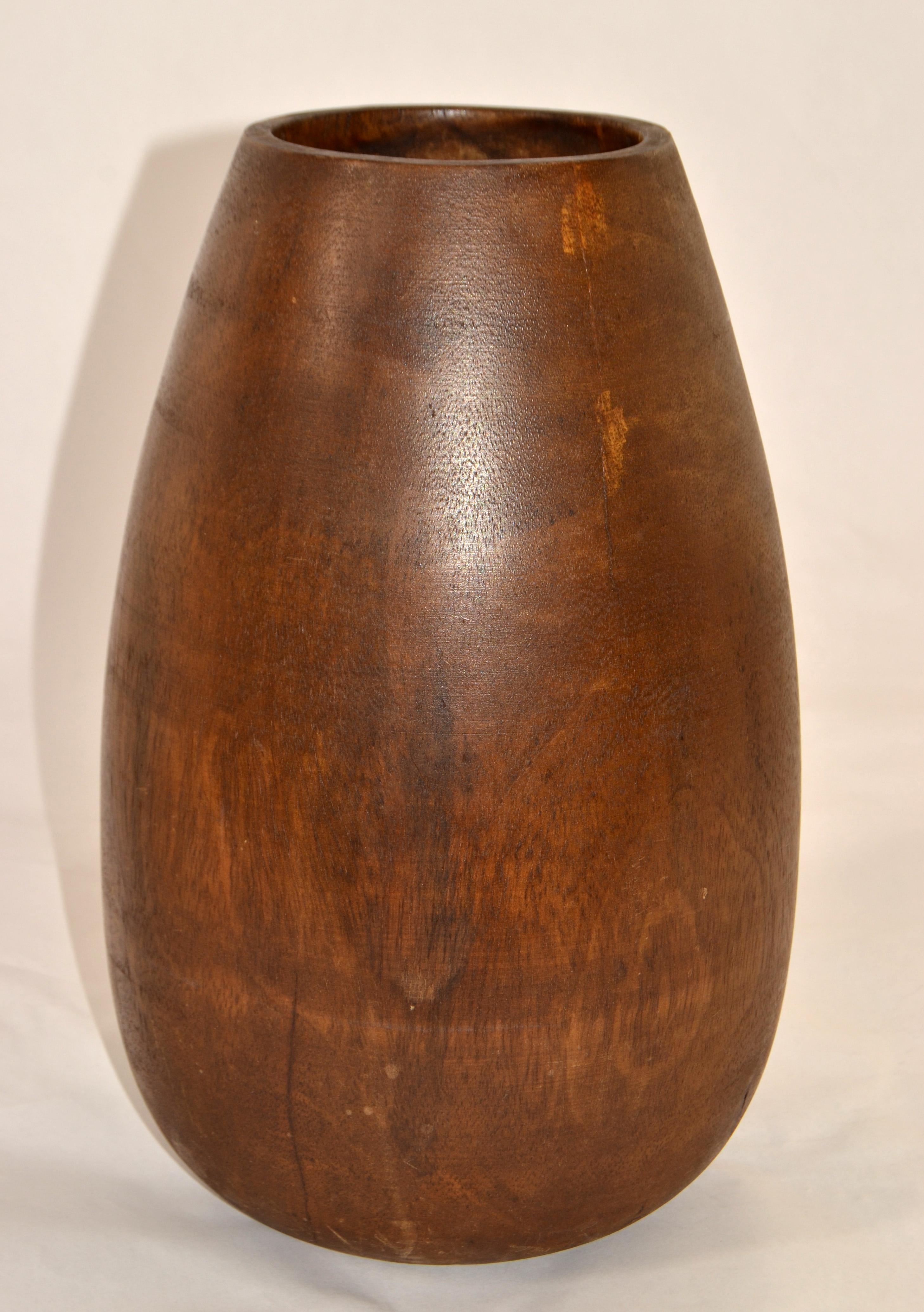 Rustic Hand-Crafted solid Wood Vase made in the Arts and Crafts Movement.
Handmade turned Solid Wood, quite heavy and in all original condition.
Some dryness and cracks to the wood.
Measures:
Height: 13 inches x 8 inches diameter.    