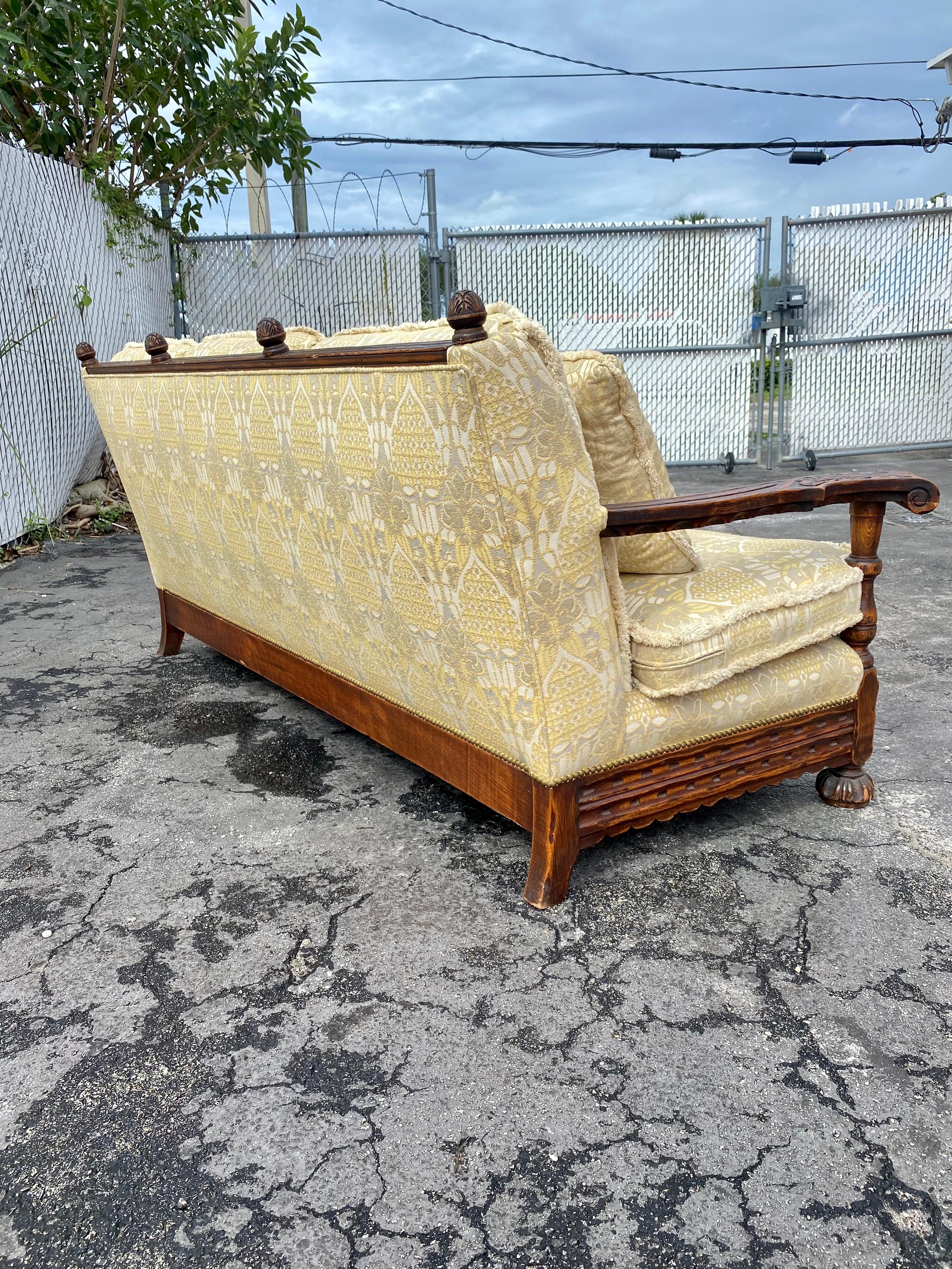 Upholstery 1950s Rustic Hand Carved Wood Fringe Sofa  For Sale