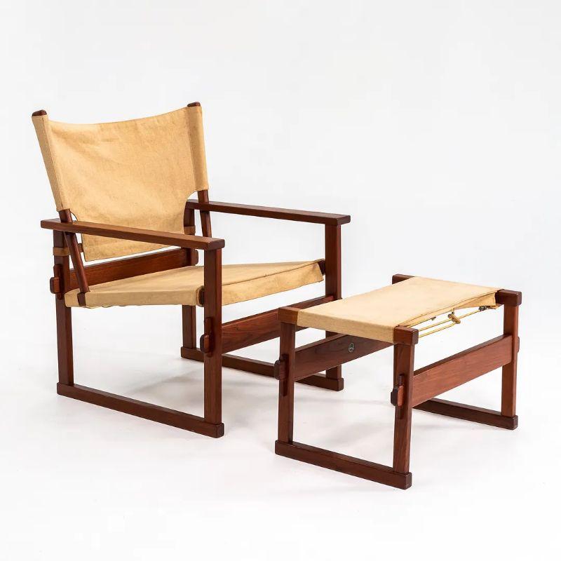 This is a Safari armchair and coordinating ottoman, designed by Poul Hundevad for Vamdrup Denmark in 1950. The frames are constructed of teak and the set retains its original natural linen canvas upholstery. To find the chair with its accompanying