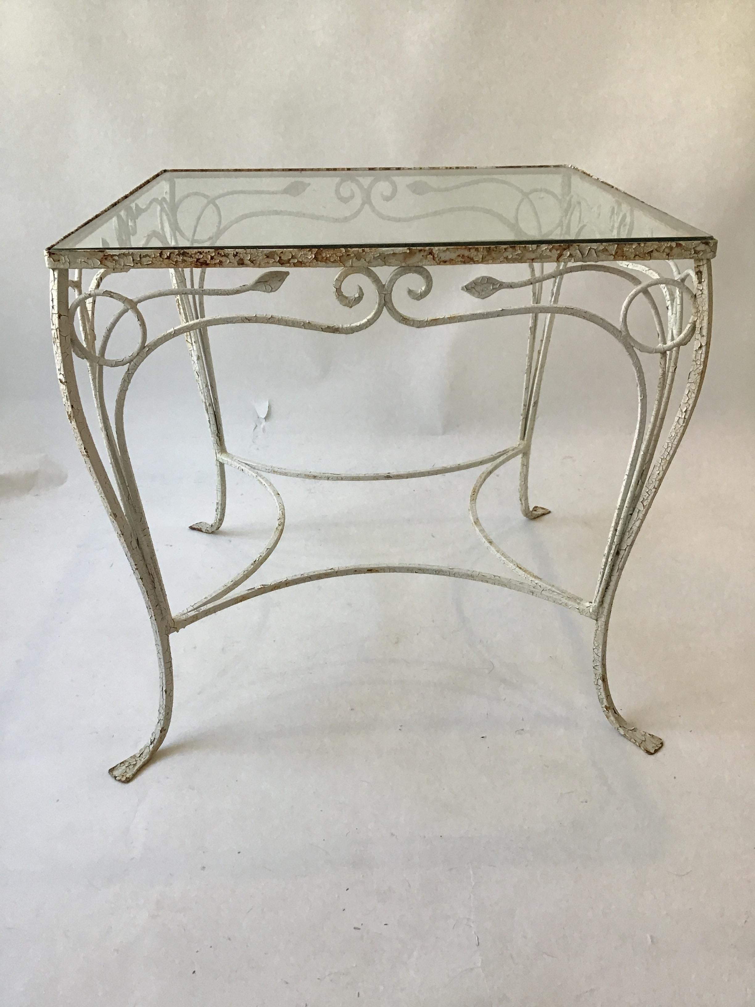 1950s Salterini wrought iron outdoor table. This table is the size of a card table.