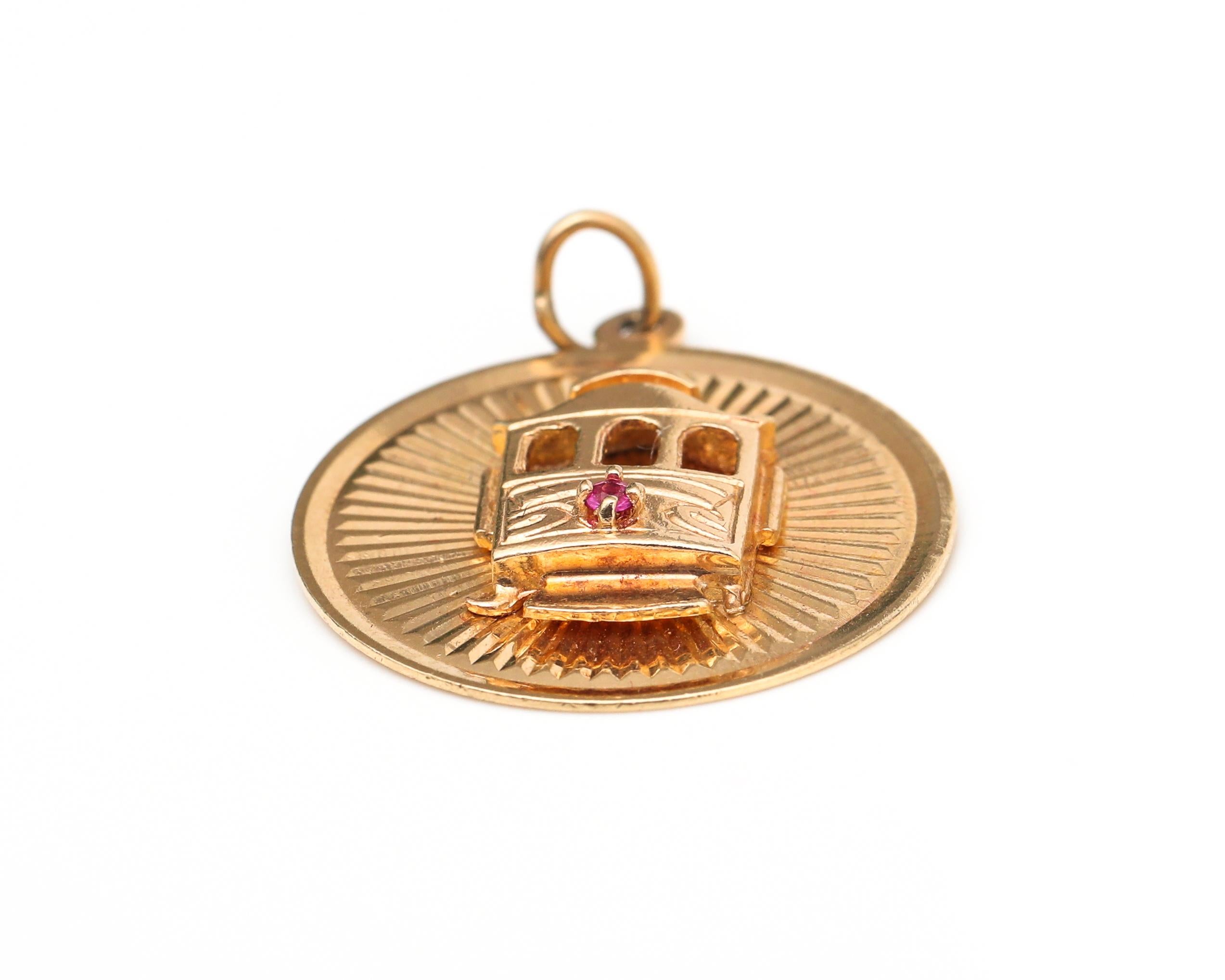 Charm details:
Gold: 14 Karat Yellow Gold
Weight: 3.79 grams
Measurement:

On the back of the charm the following is engraved: SAN FRANCISCO CABLE CAR, INVENTED BY ANDREW HALLIDEE 1873, HISTORICAL NATIONAL MONUMENT 

The cable car is made in a 3-d