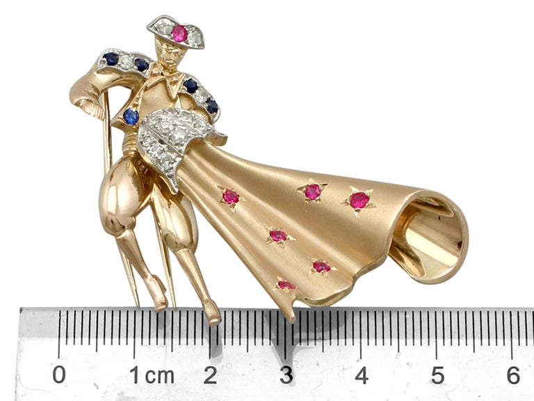 1950s Sapphire and Ruby Diamond 18K Yellow Gold Matador Brooch For Sale 2