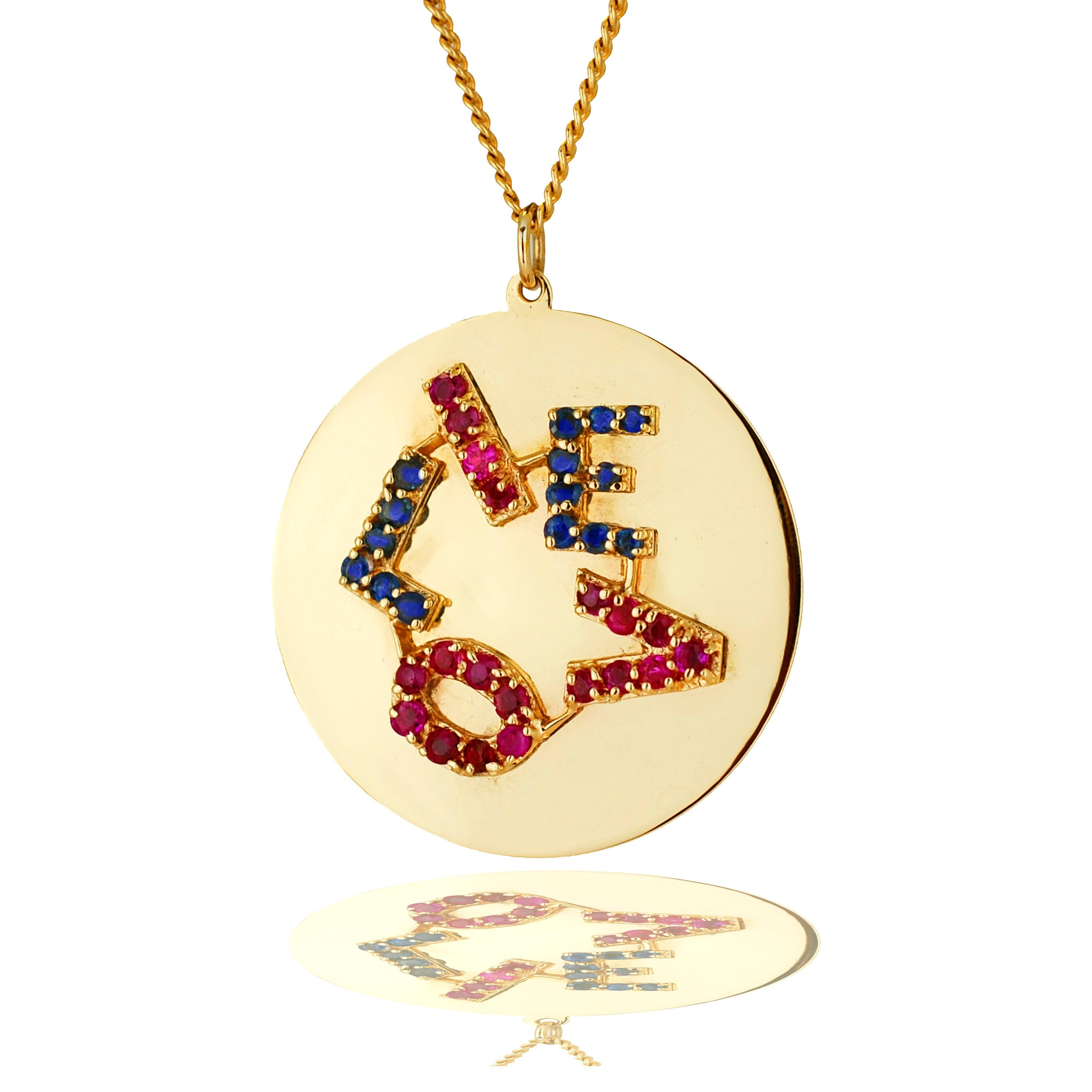 This endearing ruby and sapphire pendant is a a fun to piece to be worn with layers.  The pendant weighs 36.27 grams and has been tested at 14k yellow gold.  The pendant has thirty five 2.7-3.0mm rubies which have a natural rich red color and SI