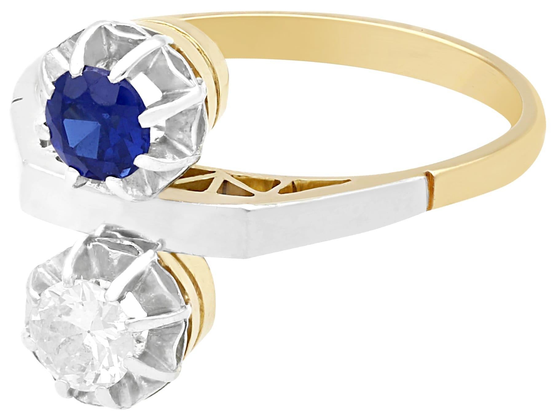 A fine and impressive vintage 0.33 carat natural blue sapphire and 0.28 carat diamond, 18 karat yellow gold and platinum set cocktail ring; part of our vintage jewelry and estate jewelry collections.

This fine and impressive vintage sapphire and