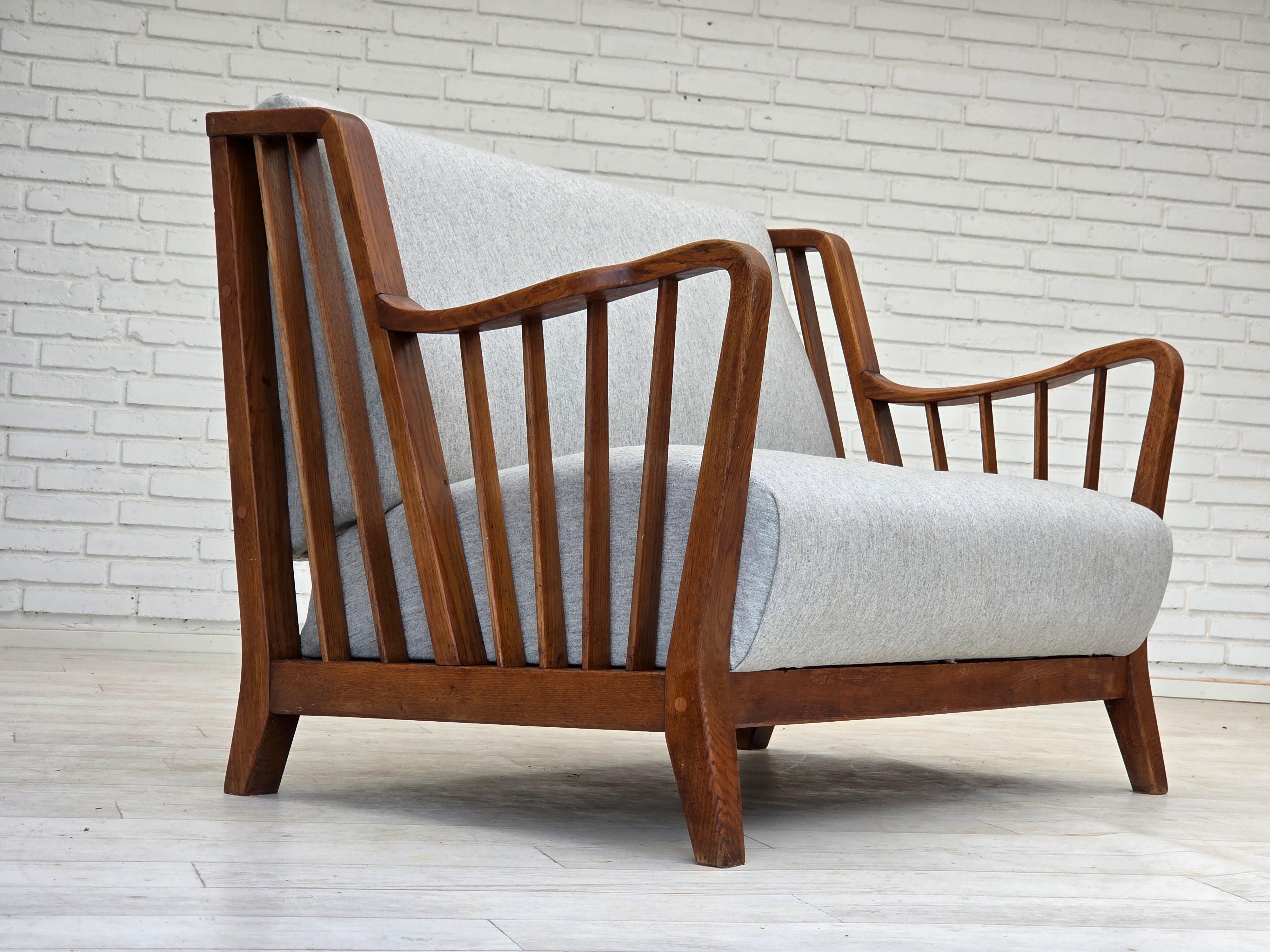 Scandinavian Modern 1950s, Scandinavian 2-seater sofa, reupholstered, furniture wool, oak. For Sale