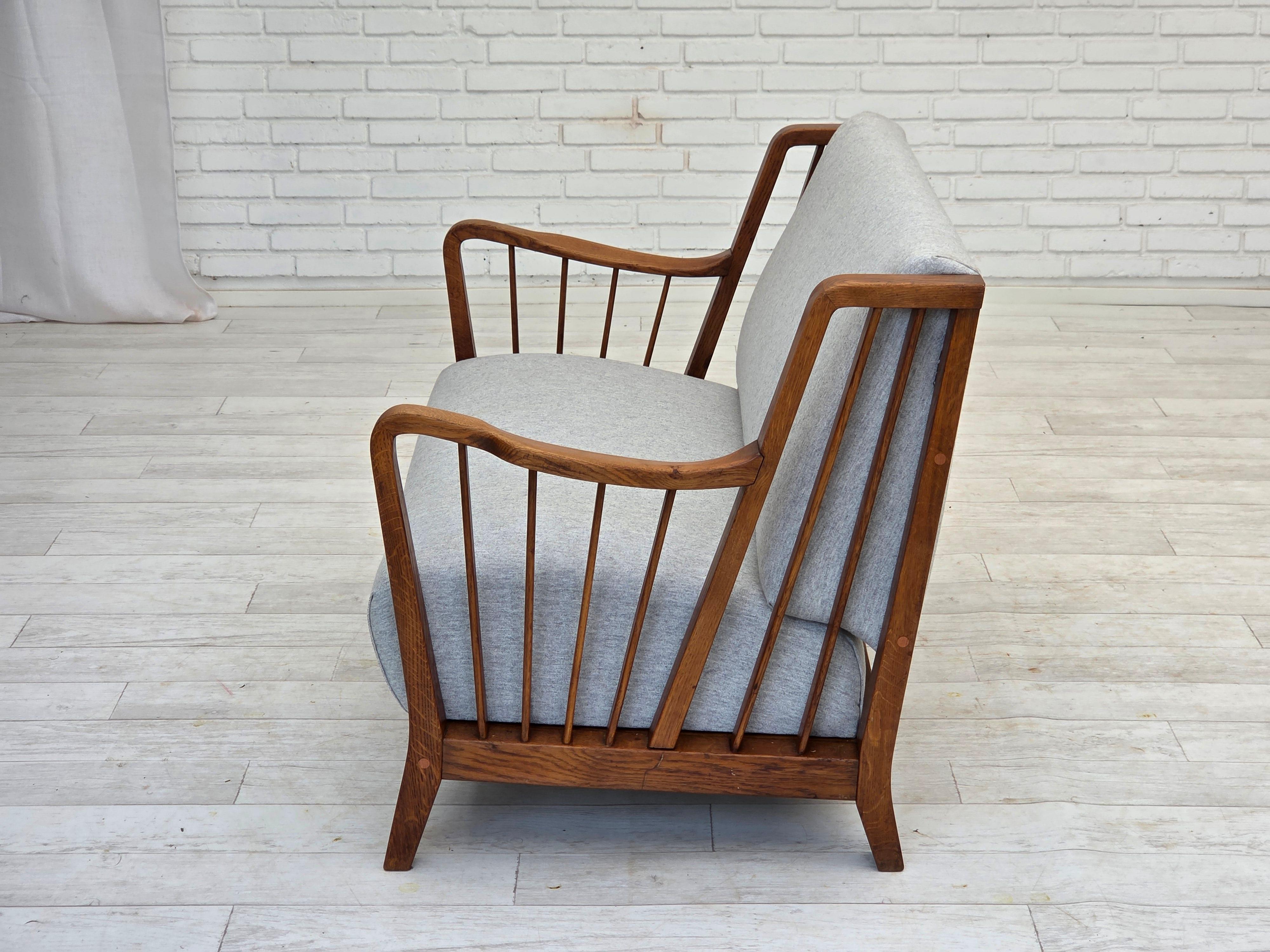 Mid-20th Century 1950s, Scandinavian 2-seater sofa, reupholstered, furniture wool, oak. For Sale