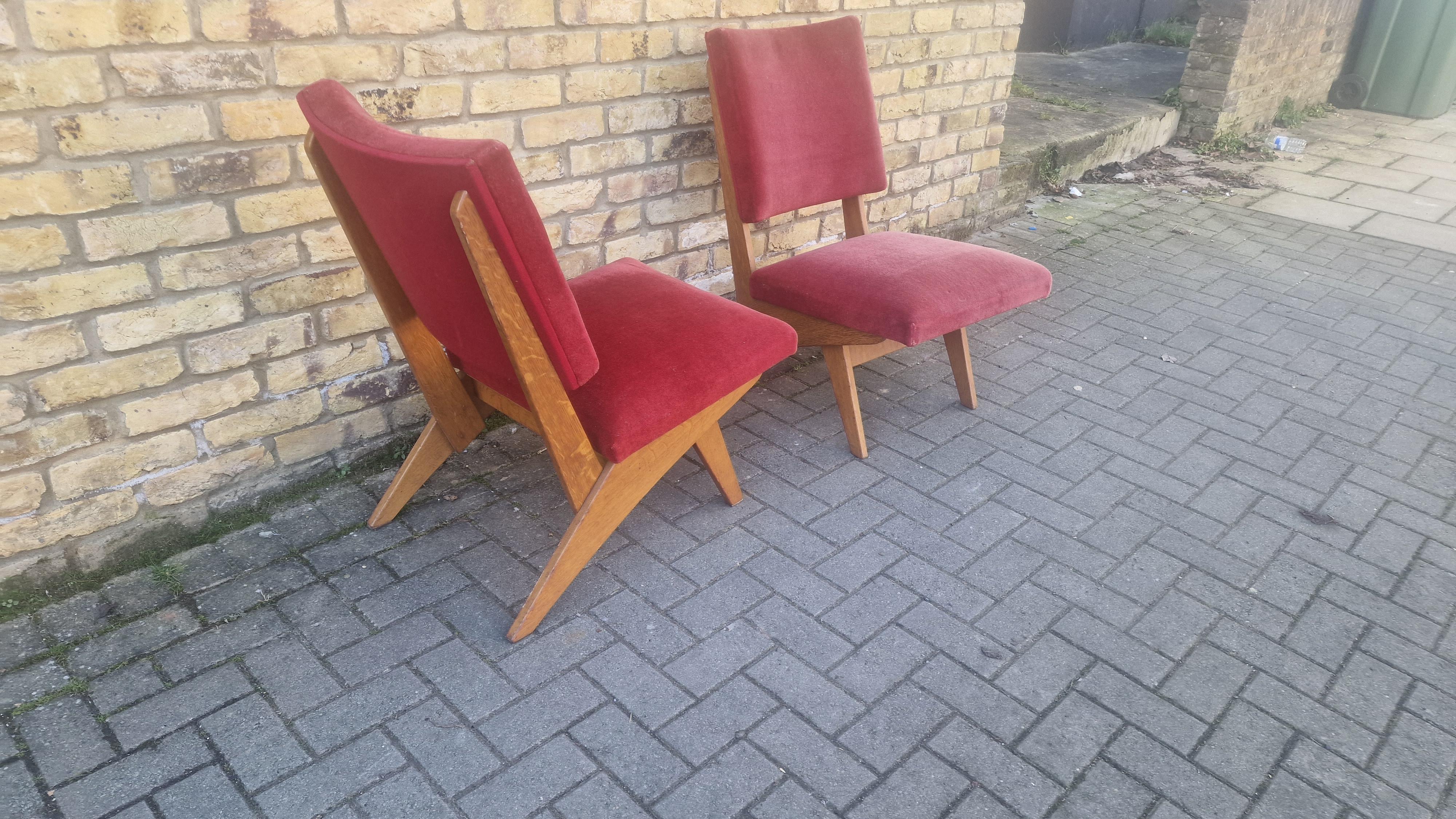 A pair of wonderfully stylish armchairs Scandinavian and well crafted 
With jointed oak frame and fabric upholstery.