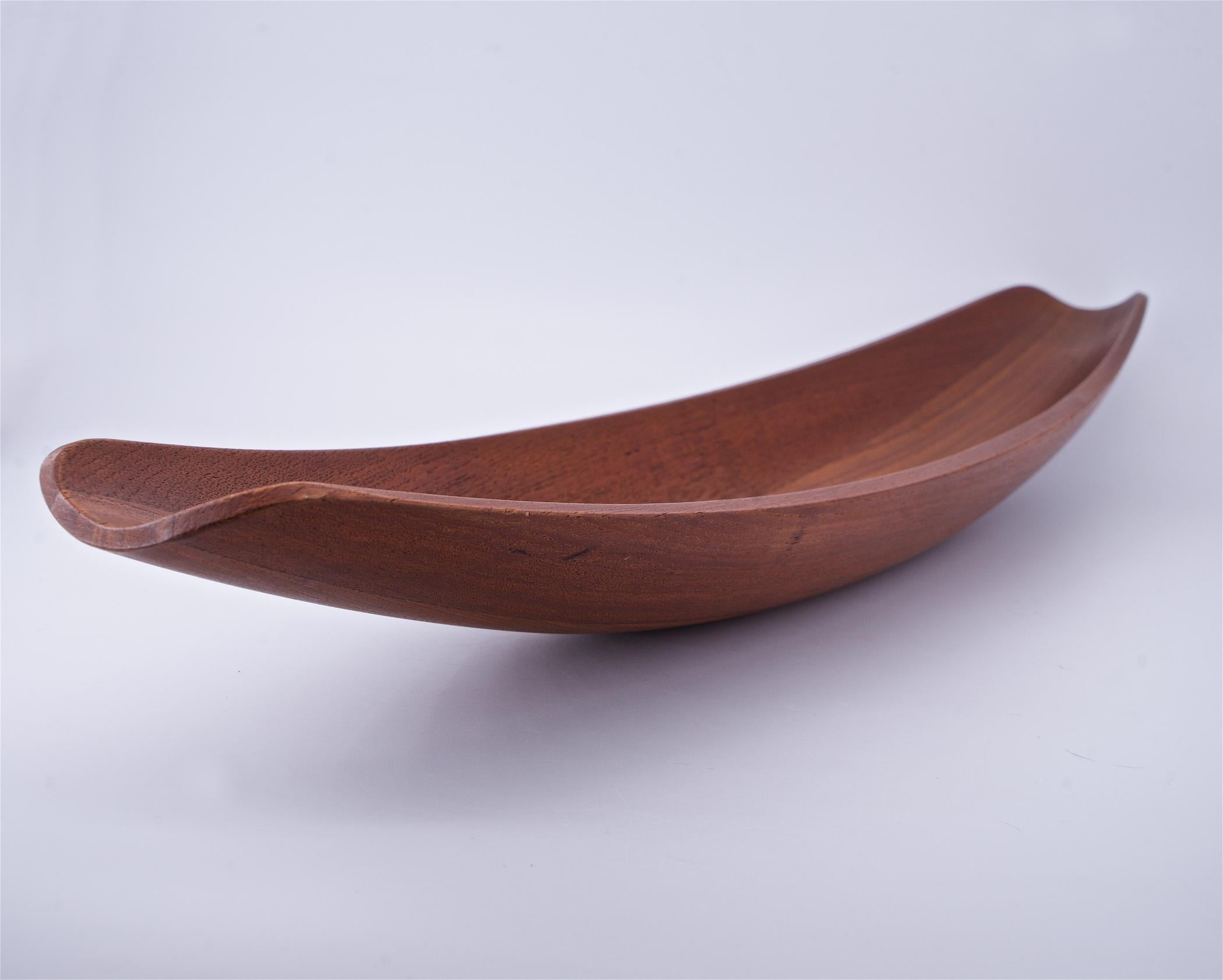 Denmark, c.1950. A long and large staved teak centerpiece fruit bowl designed by Jens Quistgaard, faint impressed marks to bottom.

 