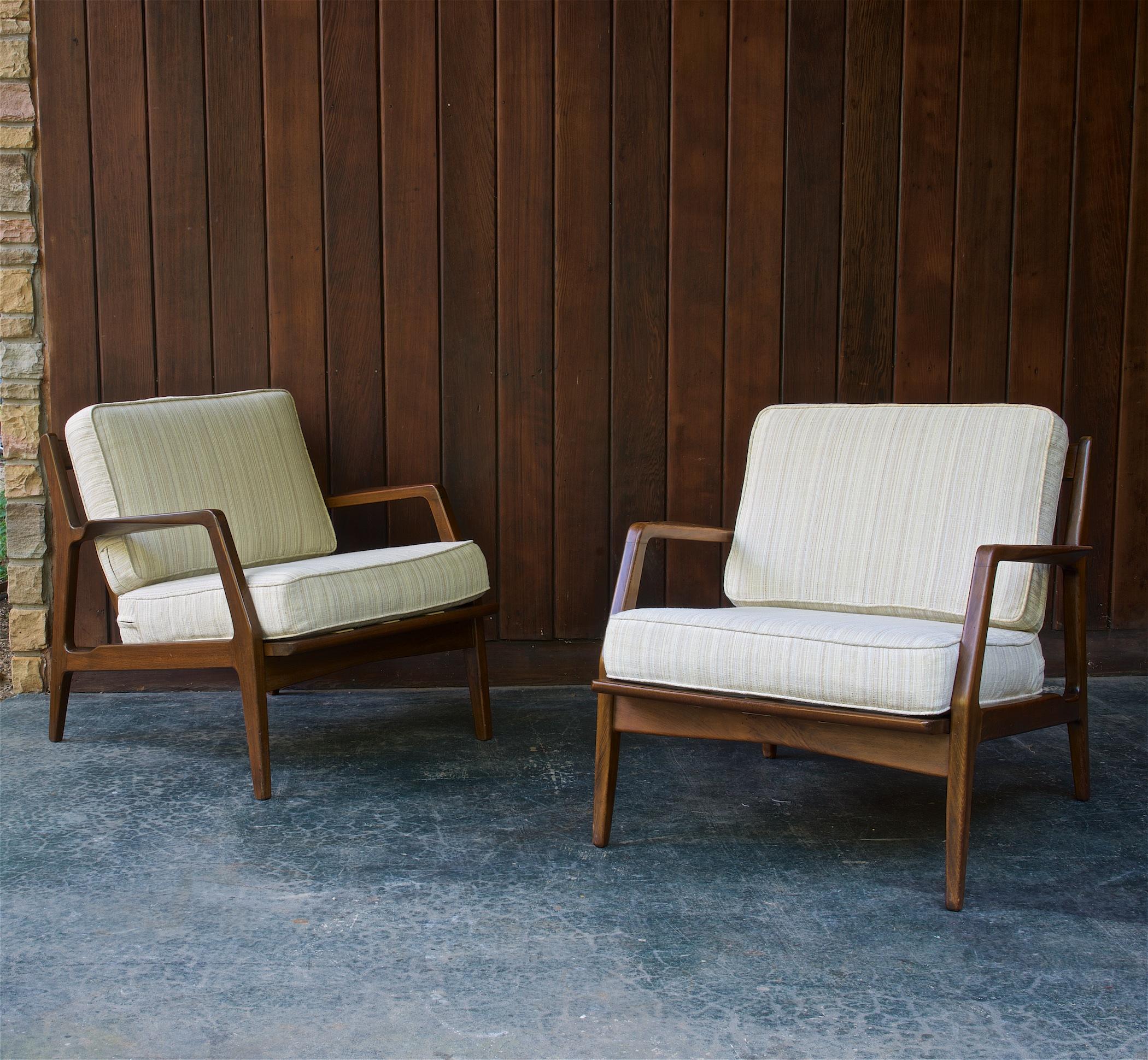 Wonderful pair of Danish 1950s Scandinavian armchair lounge chairs. Solid beech wood frames are without cracks but do with some wear to the lacquer finish, they are in unrestored as-found condition. Fin shaped spindle backs, wide outstretched