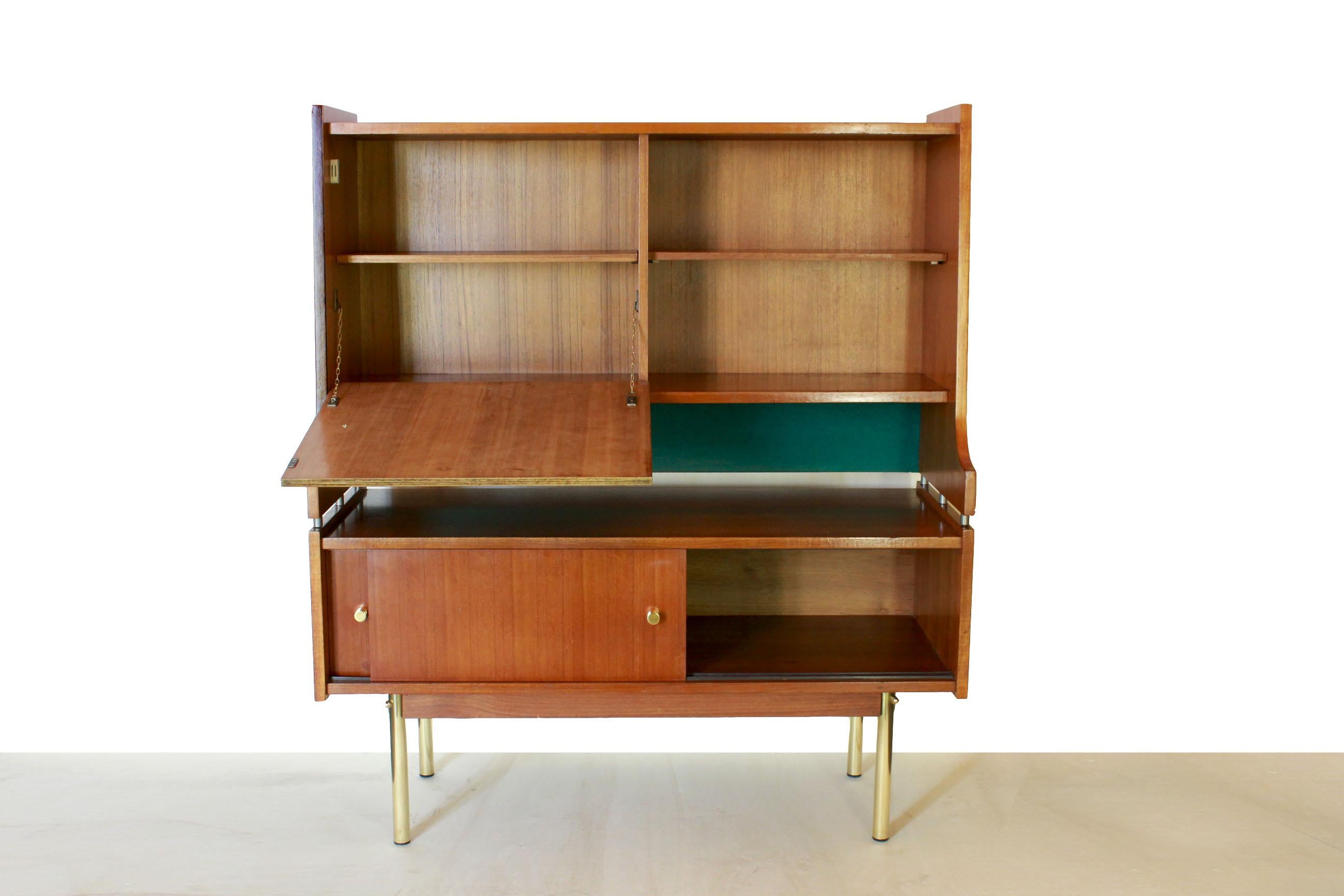 Vintage sideboard in solid teak and brass feet, Scandinavia, 1950s.
A 1950s solid teak wood sideboard with brass legs and pommels. A delicate conservative renovation has been made on wood (cleaned and polished). The pommels have been changed