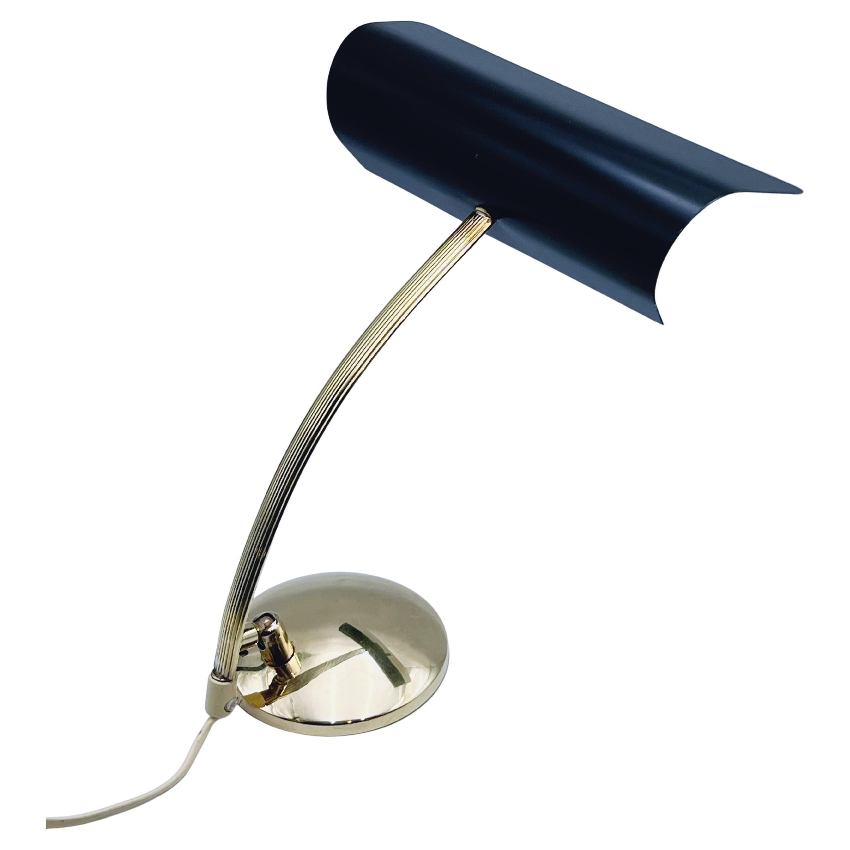 Vintage Nordic-style Scandinavian/Norwegian mid-century modern RETRO table lamp, featuring a retro design in brass/bronze and iron. Produced by AWF (Arnold Wiigs Fabrikker, Halden) in the 1950s. The lamp is height and angle adjustable, with an