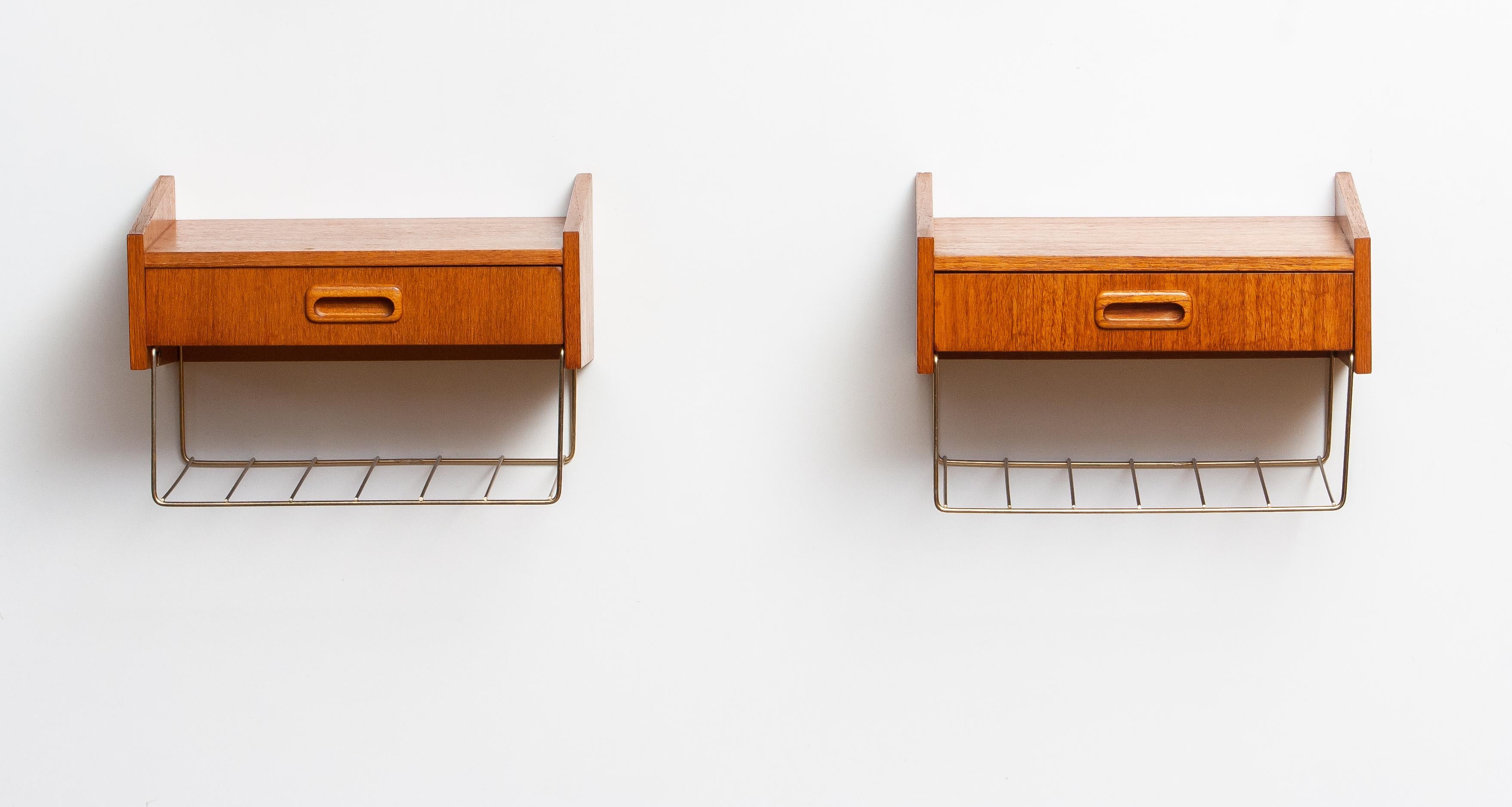 Beautiful pair wall mounted bedside tables / night stands in teak with one drawer each and a brass magazine rack attributed to Carlström & Co. Möbelfabrik in Sweden
Both are in very good condition.
Easily to mount on the wall with two hooks or