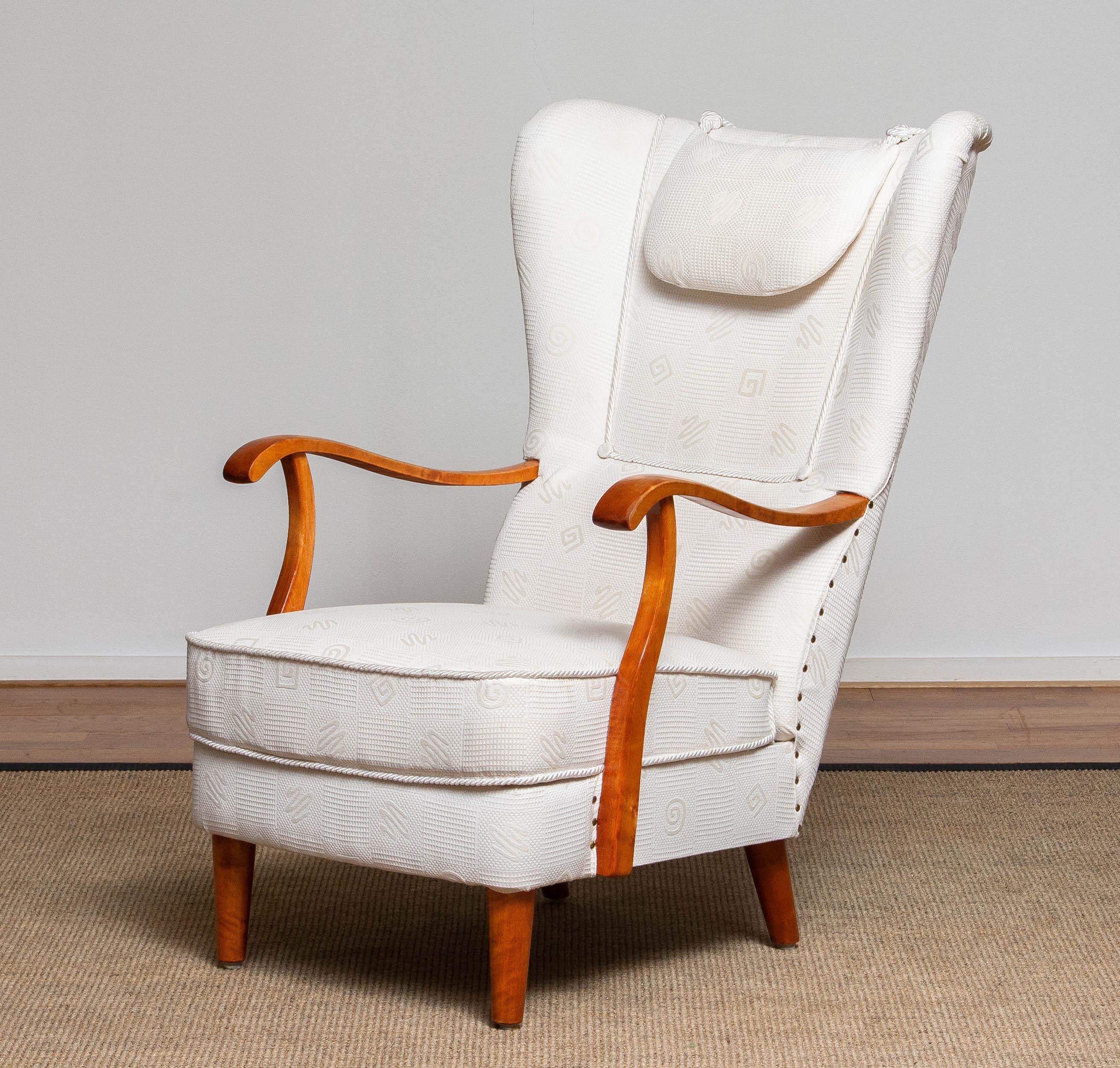 Beautiful and extremely rare gentlemen wingback chair made in the 1950's by Wilhelm Knoll for Knoll Malmö in Sweden. This chair are in a later period (90's) reupholstered in a white jacquard fabric. Constructive the chair is still original and in a