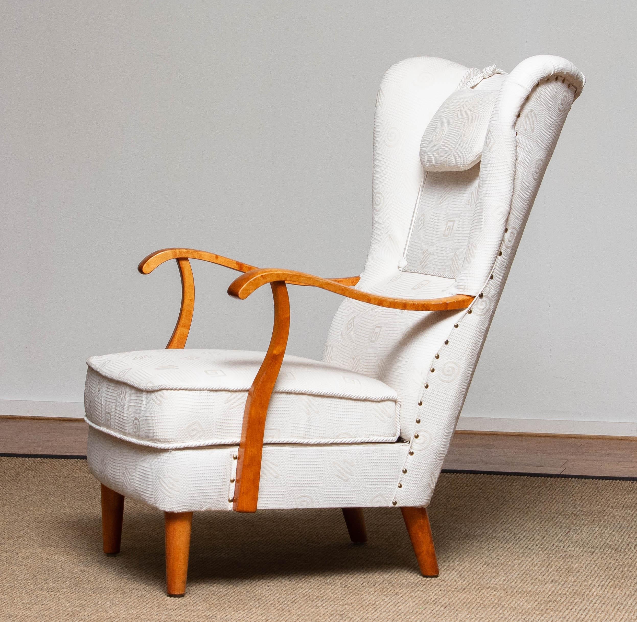 Beautiful and extremely rare gentlemen wingback chair made in the 1950s by Wilhelm Knoll for Knoll Malmö in Sweden. This chair are in a later period (90's) reupholstered in a white jacquard fabric. Constructive the chair is still original and in a