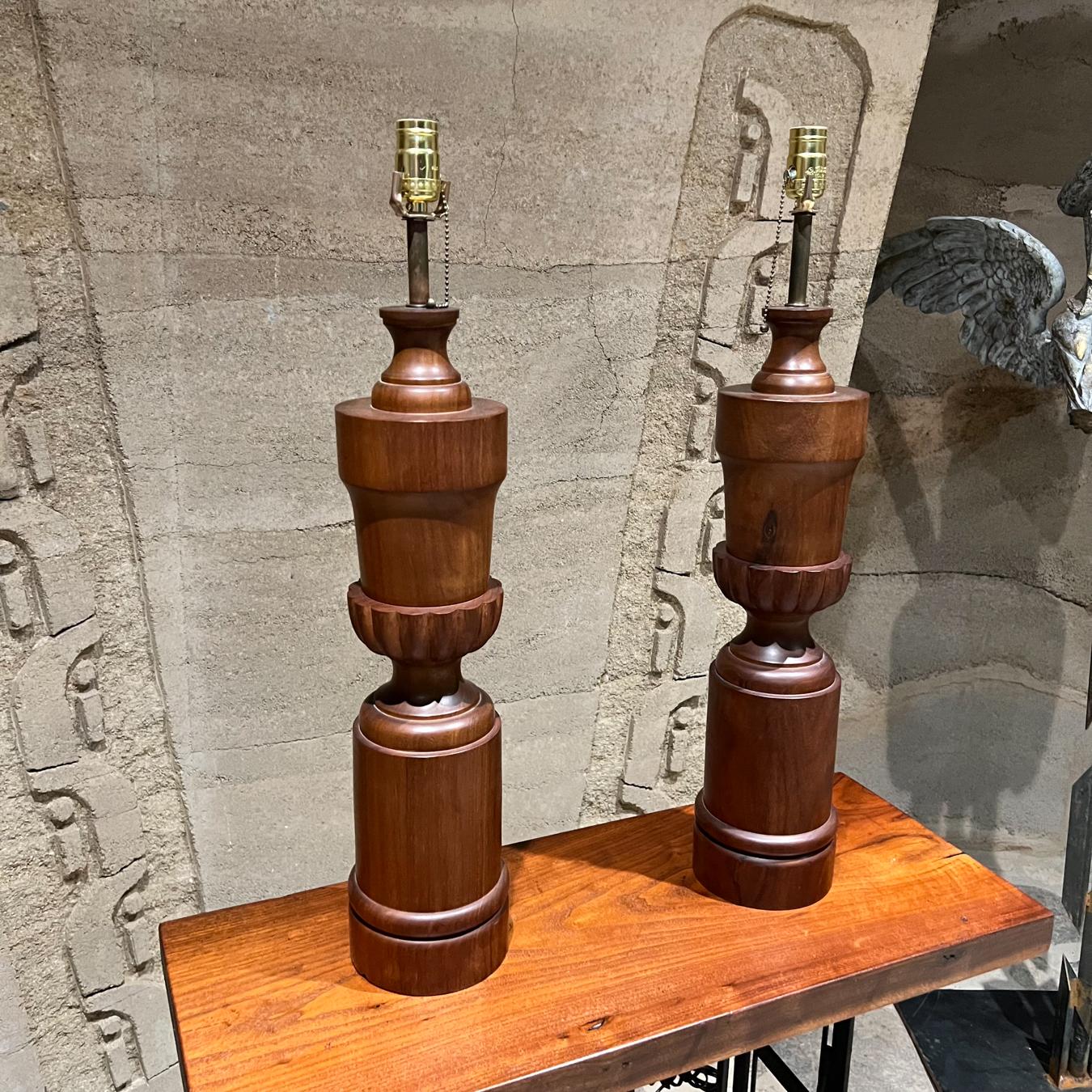 1950s Modern African solid mahogany wood sculptural table lamps
Pair of African Mahogany Wood Table Lamps very nice Sculptural Shape.
28 to the socket x 6 diameter
Preowned unrestored original vintage condition.
Original electrical cord.
Refer to