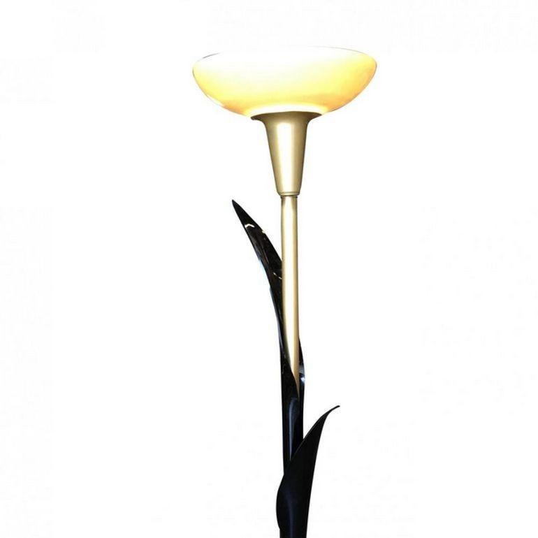 This rare 1970s floor lamp by the Canadian manufacturer Rougier. This lamp features leaf-shaped shafts elegantly rendered in onyx-black acrylic. The acrylic envelops the brass base and bass spine. The lamp is finished with an ivory glass