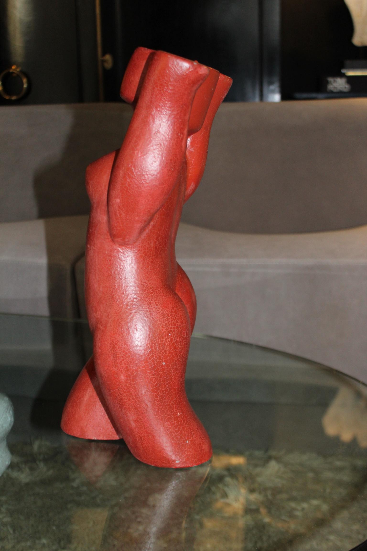 Futuristic sculpture figure of a woman in red 1950s style in ceramic.