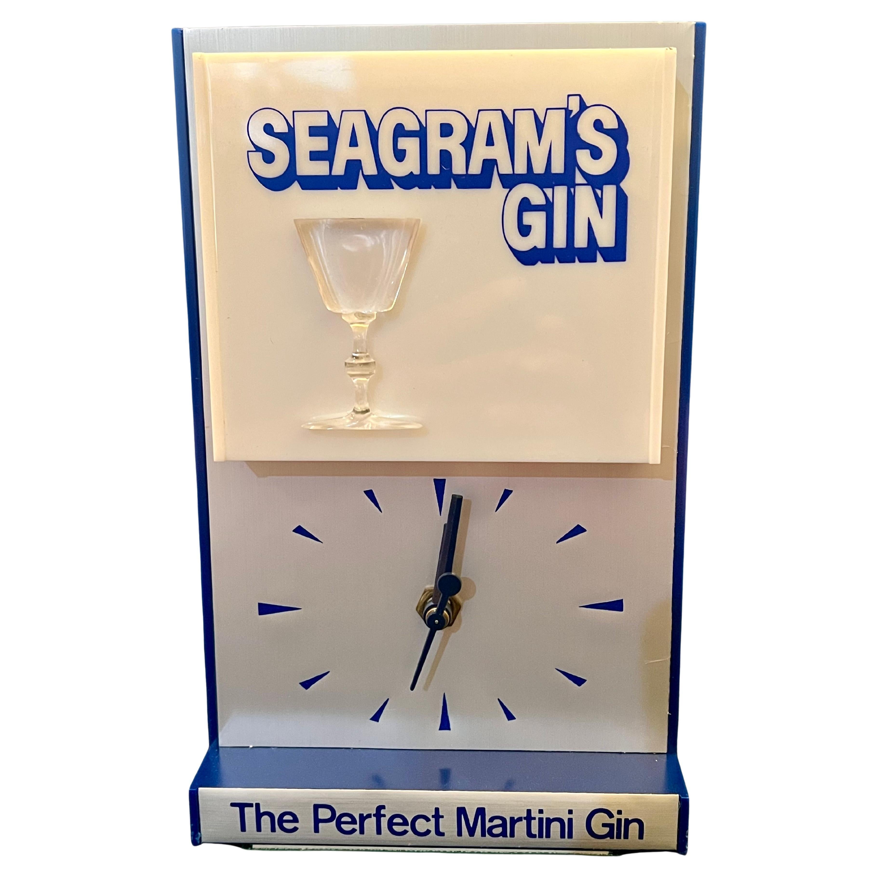 A very rare 1950's plastic box with aluminium face electric clock with illuminated martini cup , we have 4 available new old stock a very rare find beautiful piece for a mancave or sign collector. table top 