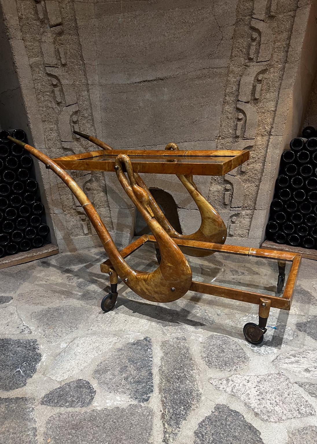 1950s Sensational Aldo Tura Bar Dessert Service Cart
Sculptural Italian Wood with Patinated Brass Accent
Two glass shelves
28.5 tall x 19.5 w x 45 d
Preowned original condition
Please review.