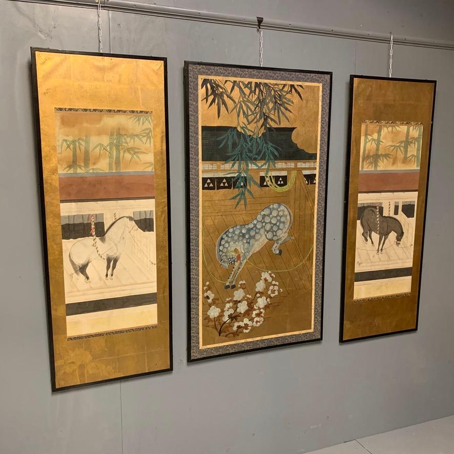 Very decorative and unusual set of 3 Chinese hanging gilt and painted screens.
All three are in good condition and suit the ebonized flush fitting frames well.
Hand painted horses and fabulous blooms, contrasting well with the gilt finishing to
