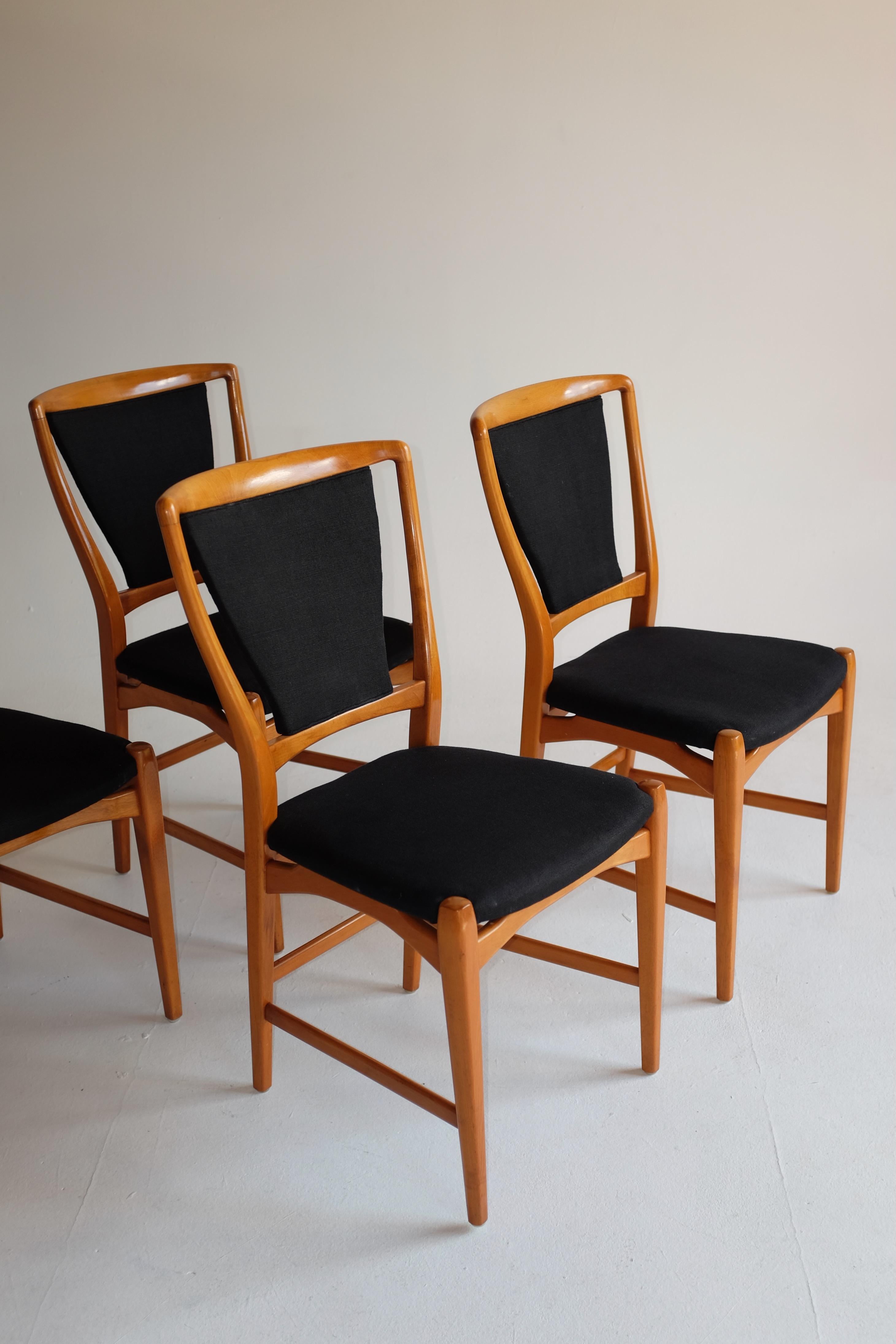 1950s Set of 4 dining chairs by Westbergs Möbler, Sweden. Beautiful curved and elegant design with a contrast black linen upholstery. The wooden frame has been restored but show some signs of wear (please see photos) as does the black