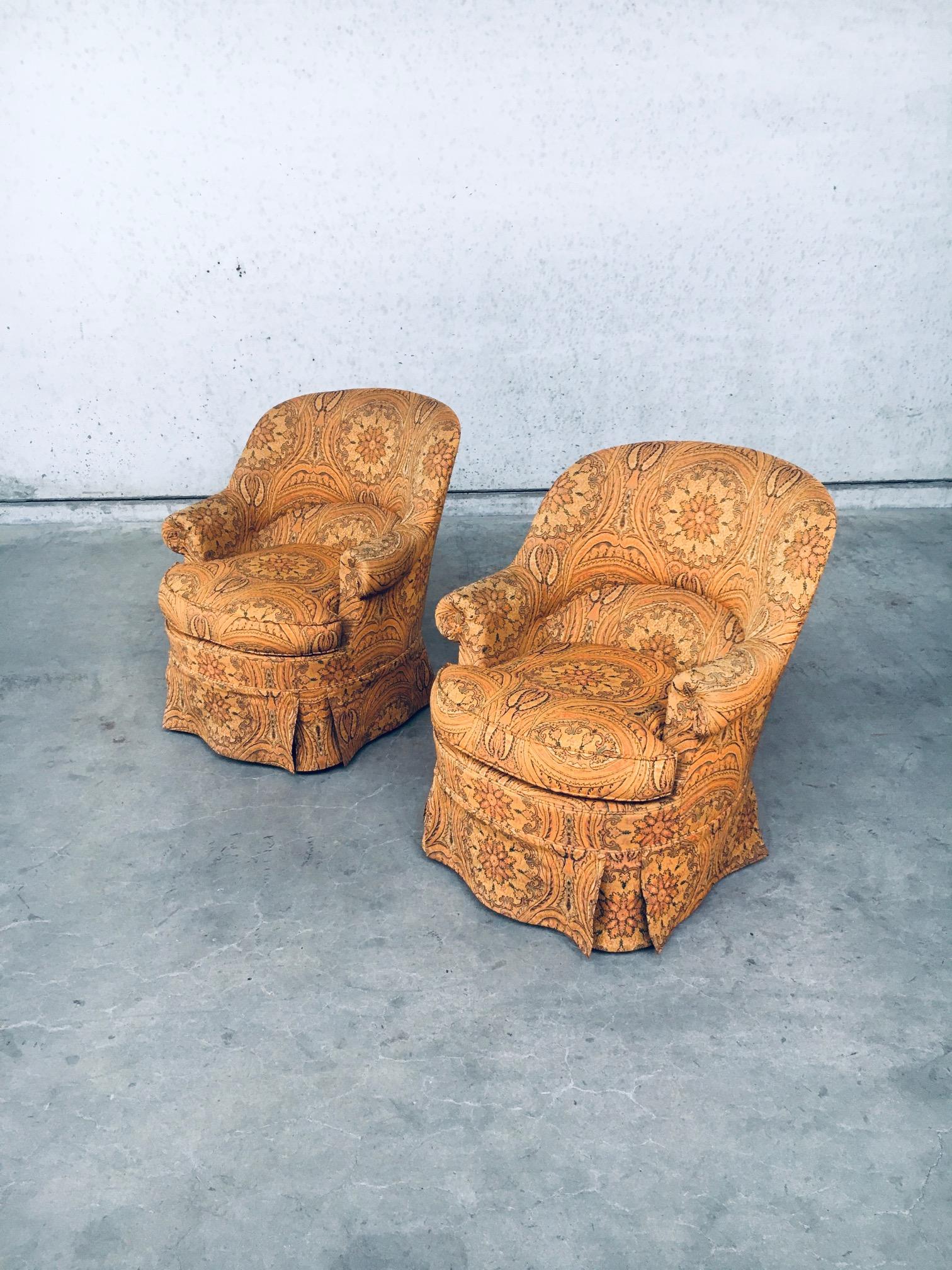 Vintage Crapaud Cocktail Lounge Armchair Fauteuil set. Made in France, 1950's. Psychedelic flower print in orange toned fabric on these all original side chairs. Both are all original and in very good, hardly used condition. Each measures 79cm x