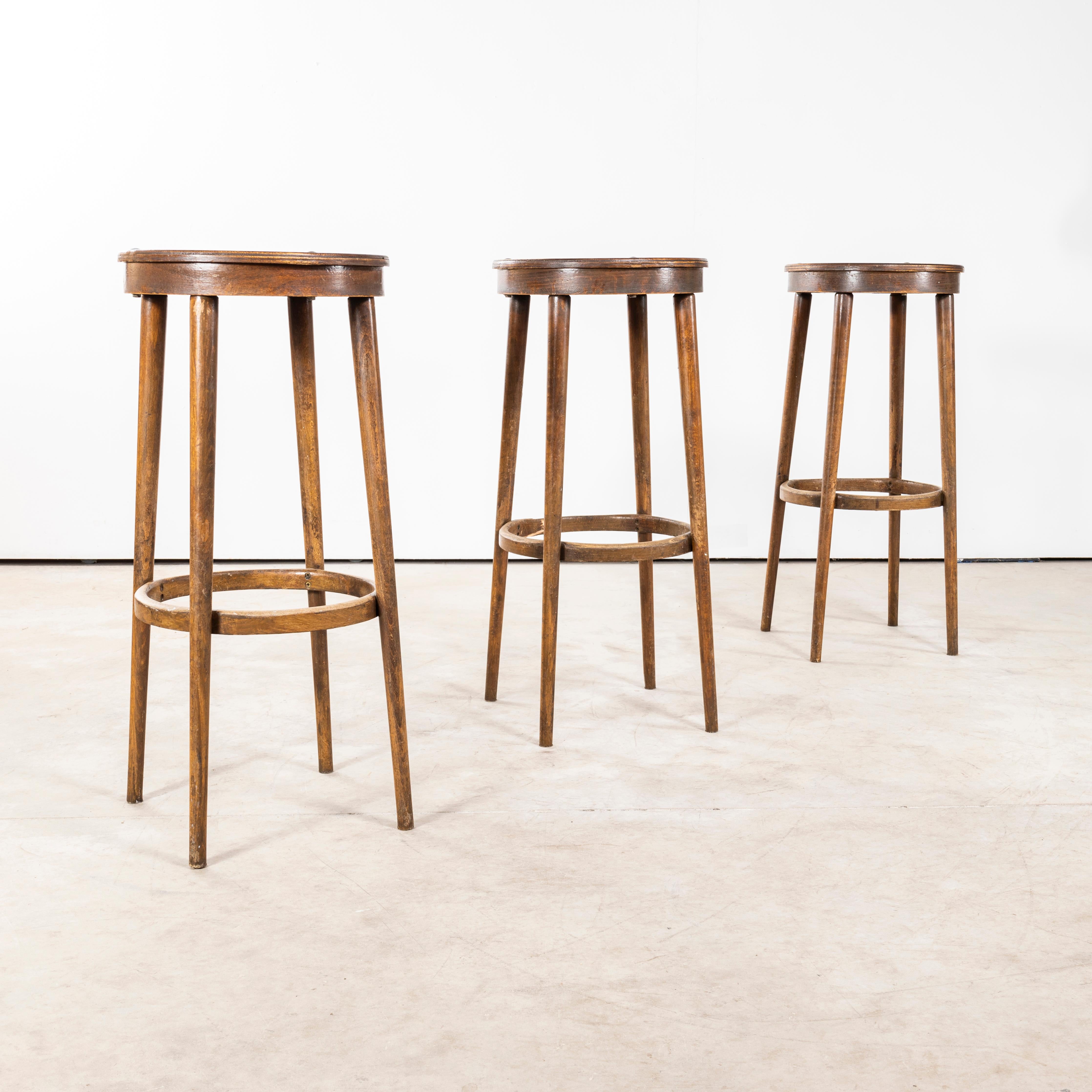 1950's Set Of Elegant Tall Bar Stools - Set Of Three. 

Elegant original French stools, the ply tops are not original but are a practical repair that was carried out many years ago, we like retaining that history and it adds to their