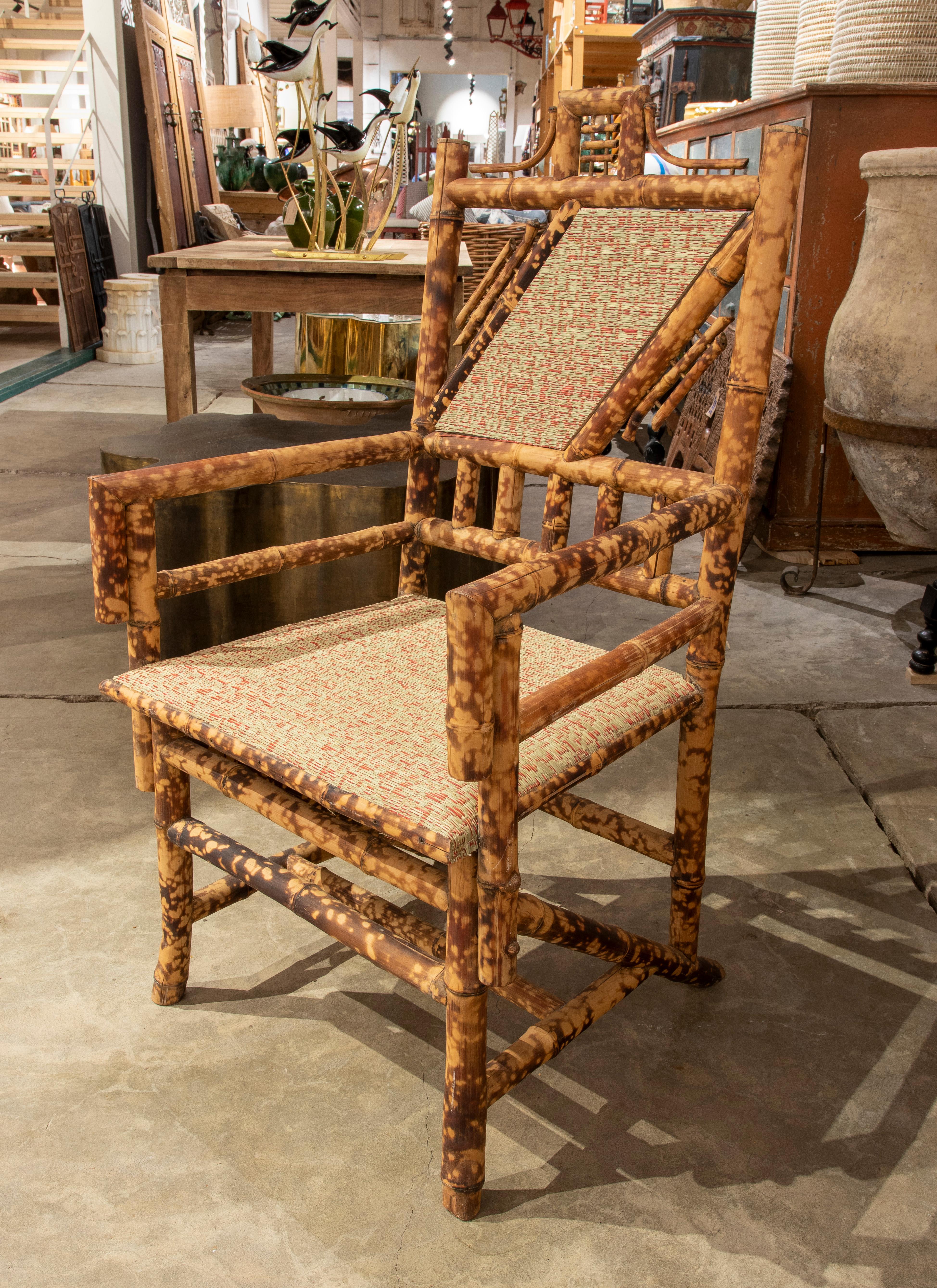 1950s Set of four bamboo armchairs with natural Raffia seat and backrest.
