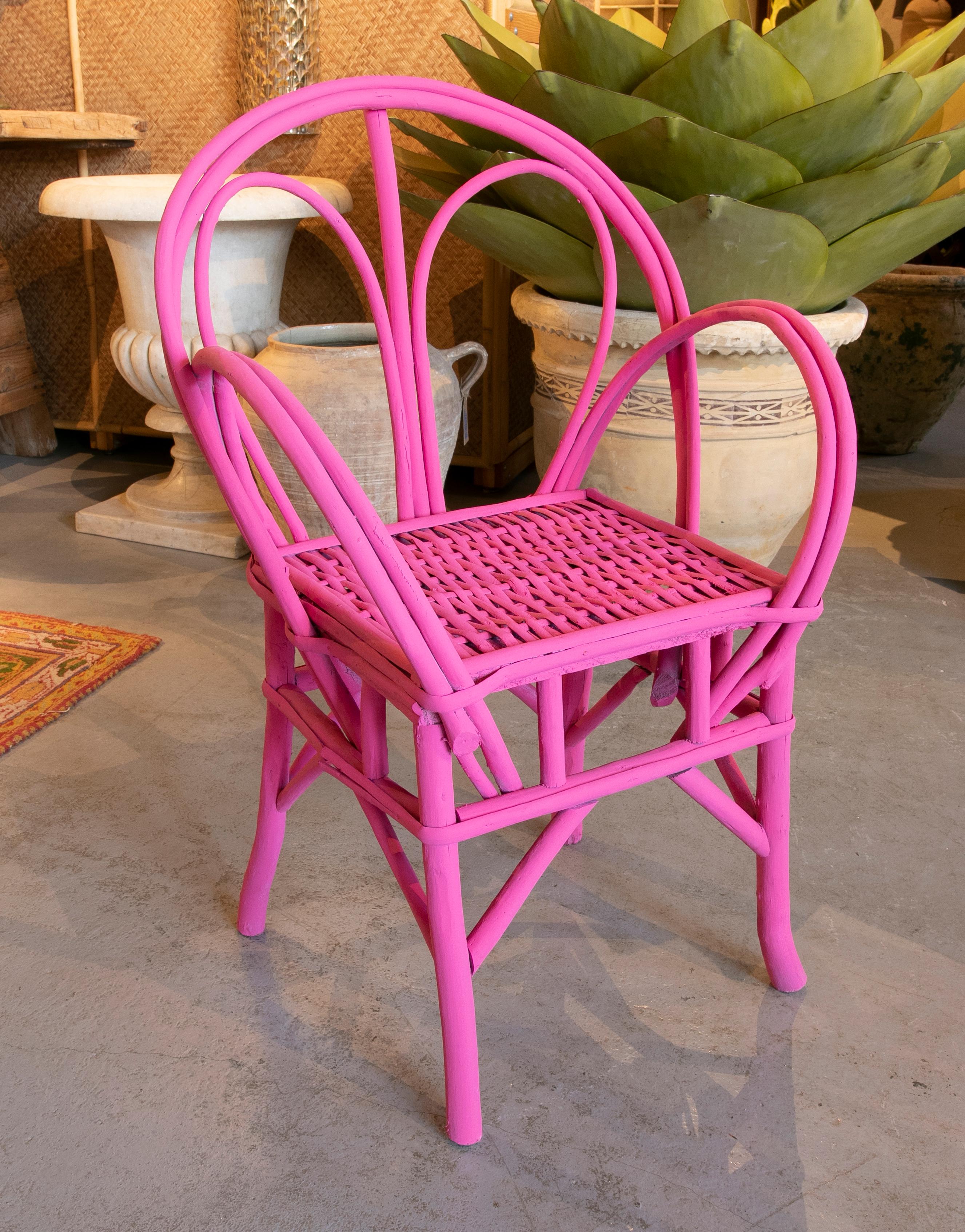 1950s Set of four wooden chairs painted in pink.