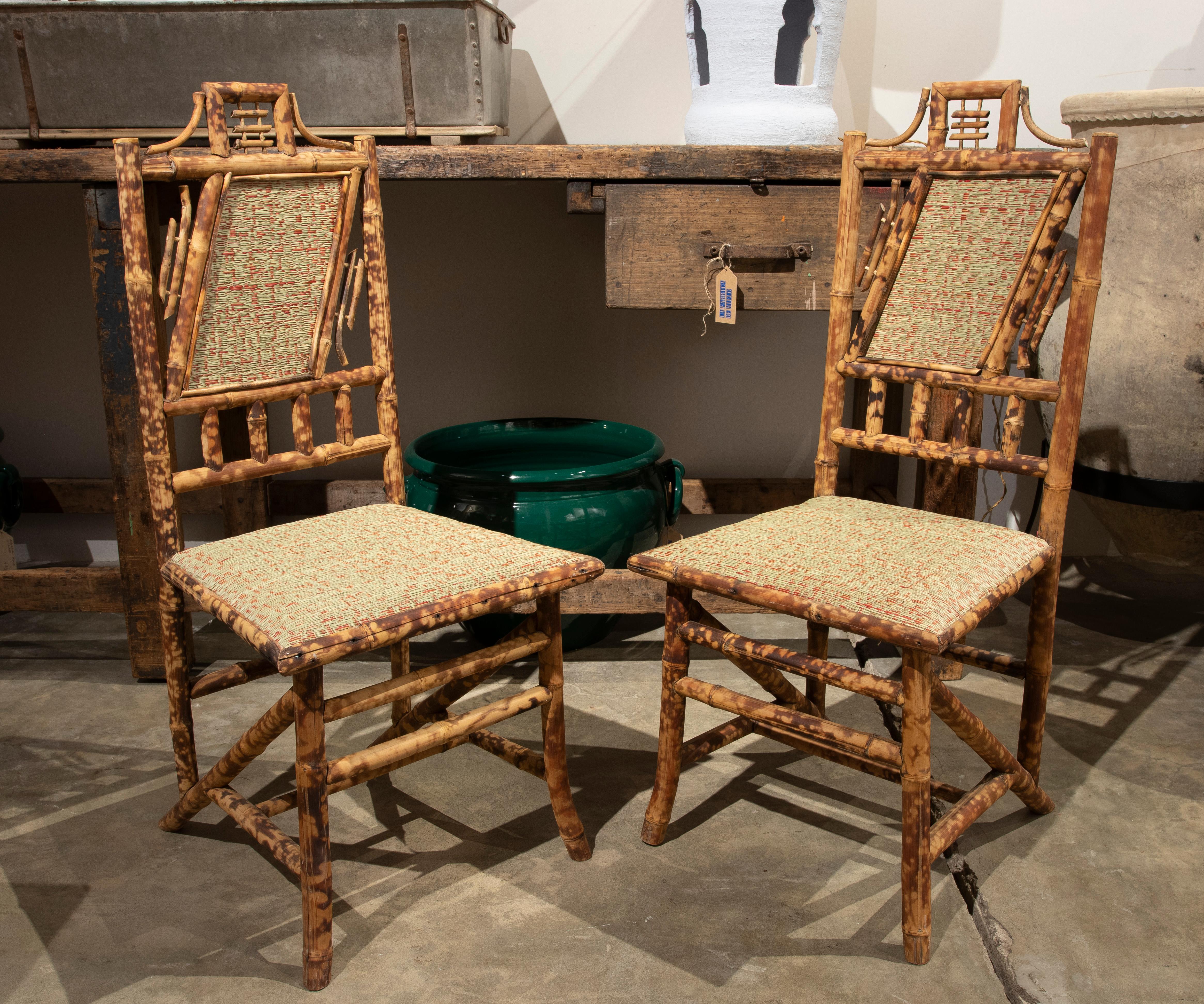 1950s set of six bamboo chairs with natural raffia seat and backrest.