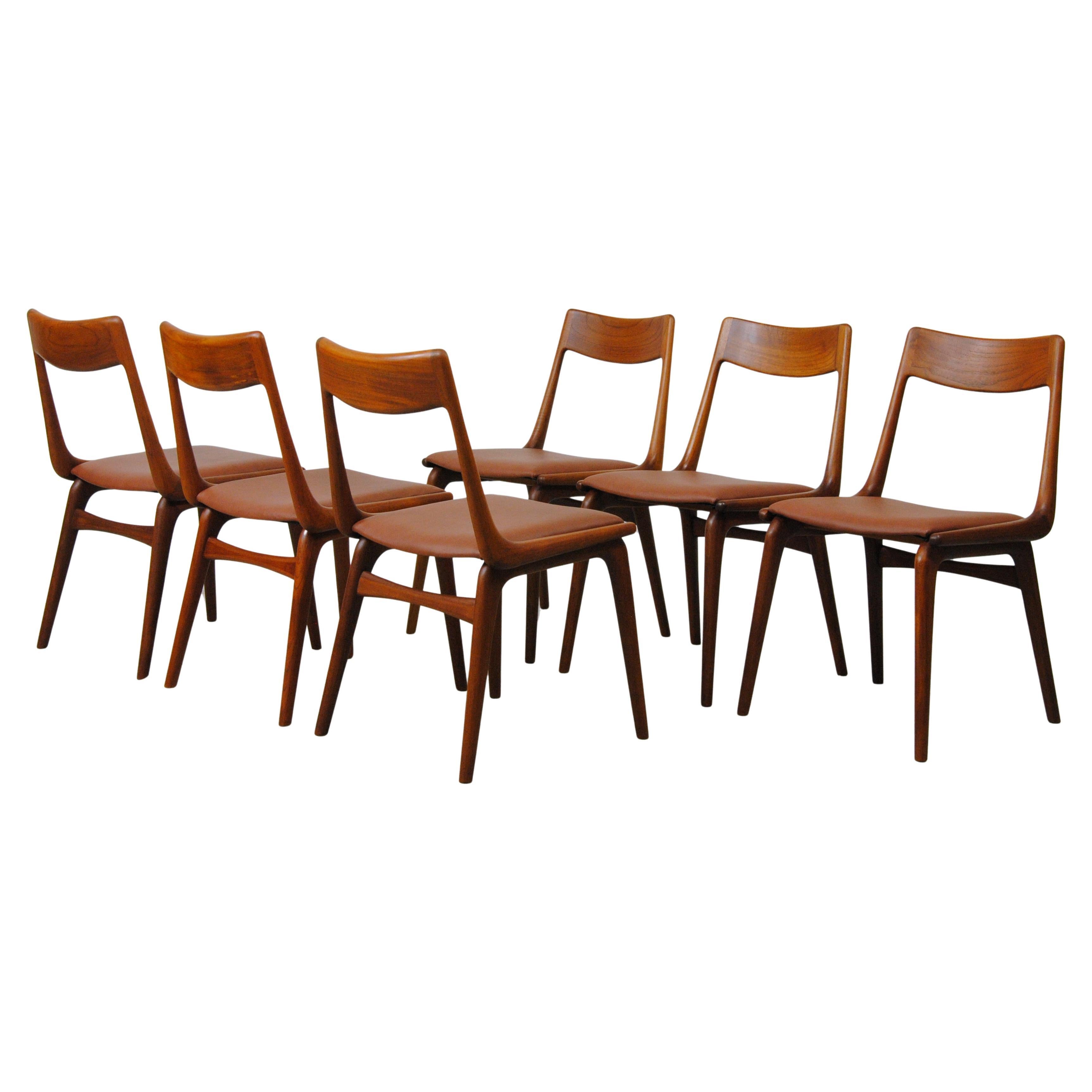 Juego de seis Sillas de comedor danesas tipo boomerang de los años 50, de teca, totalmente restauradas, de Alfred Christensen para Slagelse Møbelfabrik.

Las sillas, muy cómodas, tienen un armazón sencillo pero elegante en forma de boomerang de teca