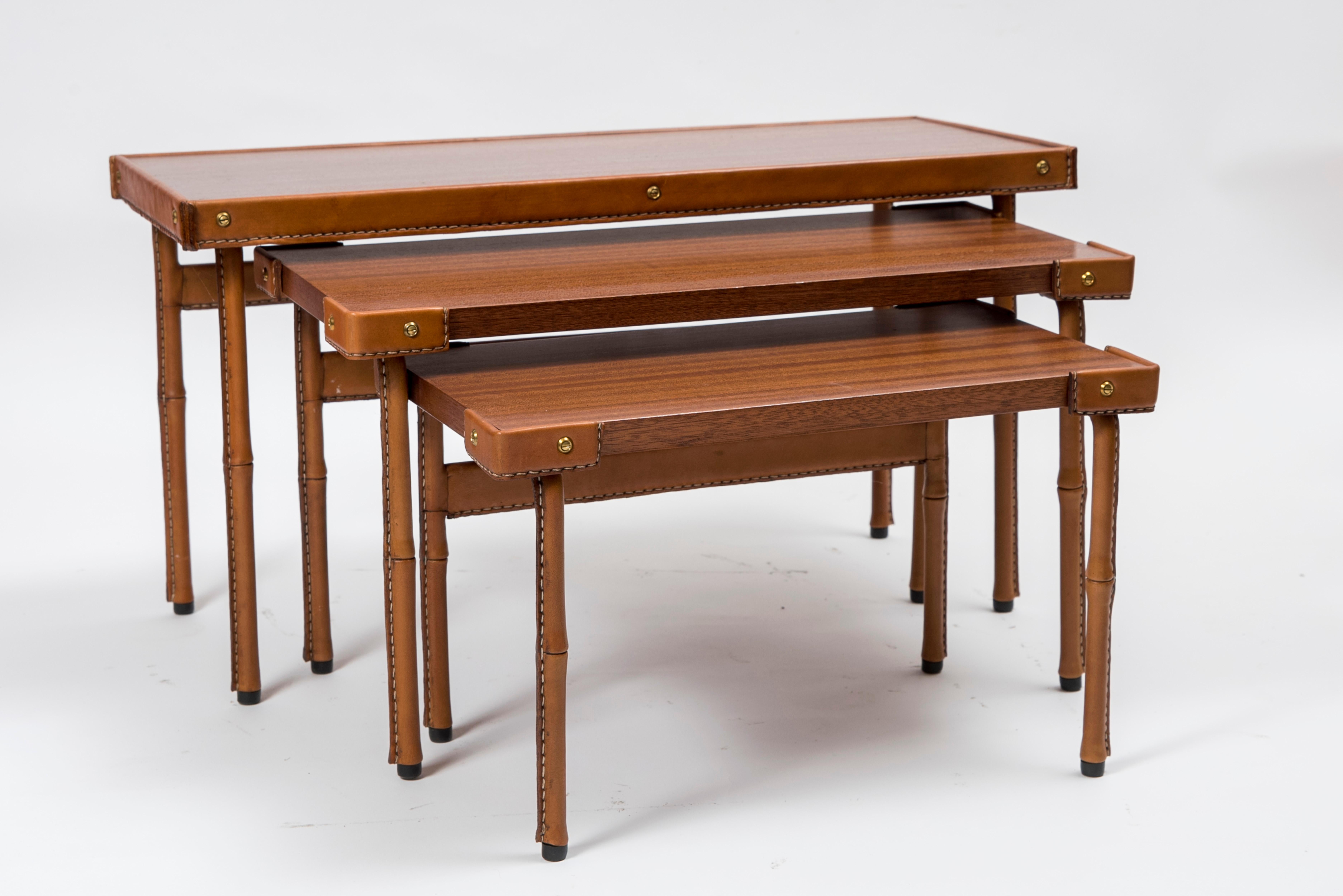 1950s set of stitched leather nesting tables by Jacques Adnet
Measures: 1- 65 x 25 x 33 cm
2- 51 x 23 x 28 cm
3- 43 x 25 x 25 cm
Great condition.