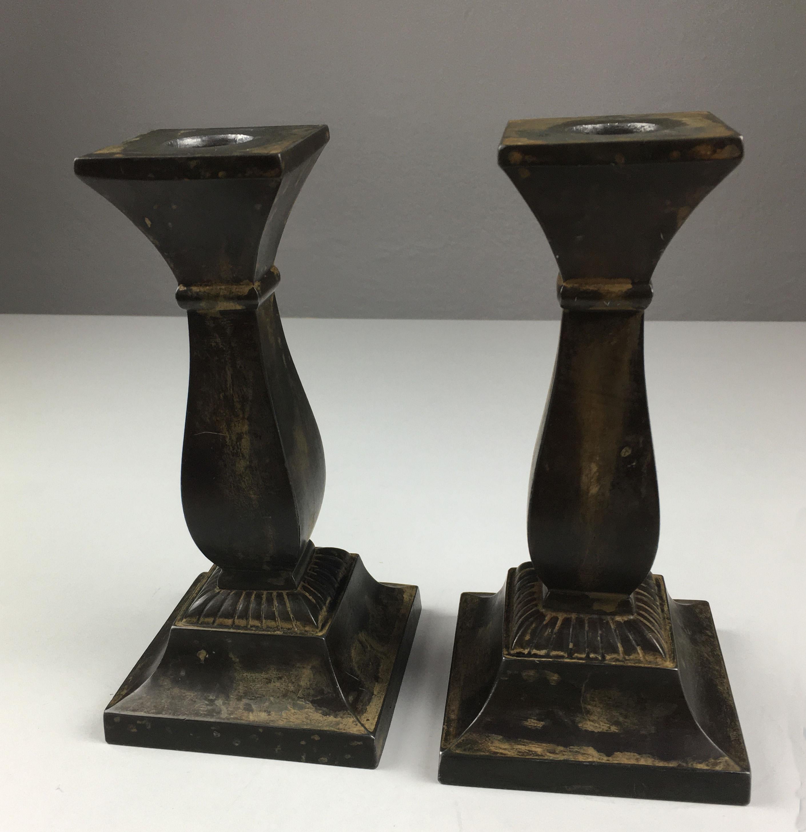 Set of two Danish Just Andersen disco metal candle holders produced by Just Andersen A/S in the 1940 - 50's.

The candle holders are in good vintage condition and marked with Just. Andersens triangle mark. 

Just Andersen 1884-1943 was born in