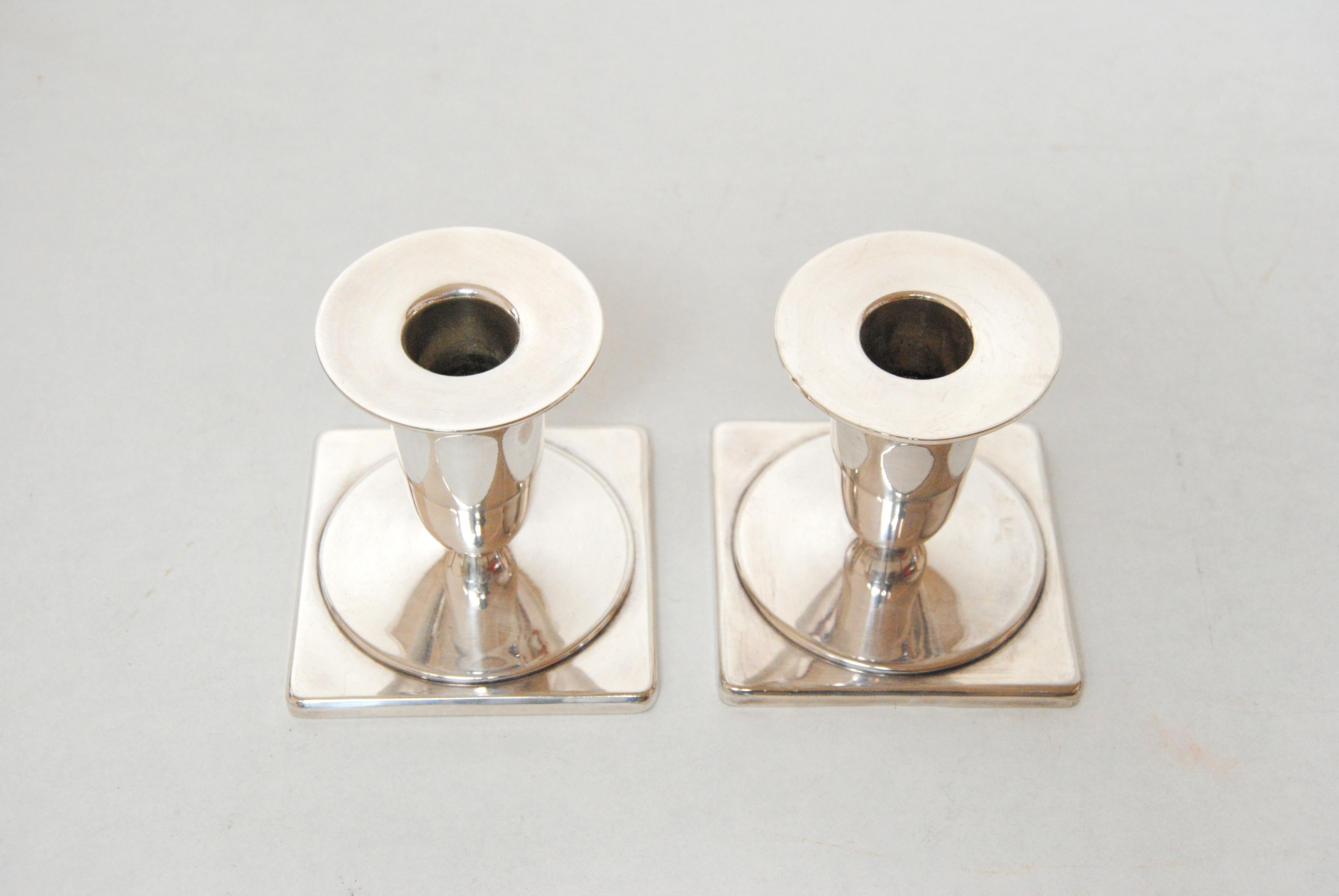 Set of two Danish Just Andersen silver plate candle holders produced by Just Andersen A/S in the 1950´s.

The candle holders are in good vintage condition and marked with Just. Andersens triangle mark. 

Just Andersen 1884-1943 was born in