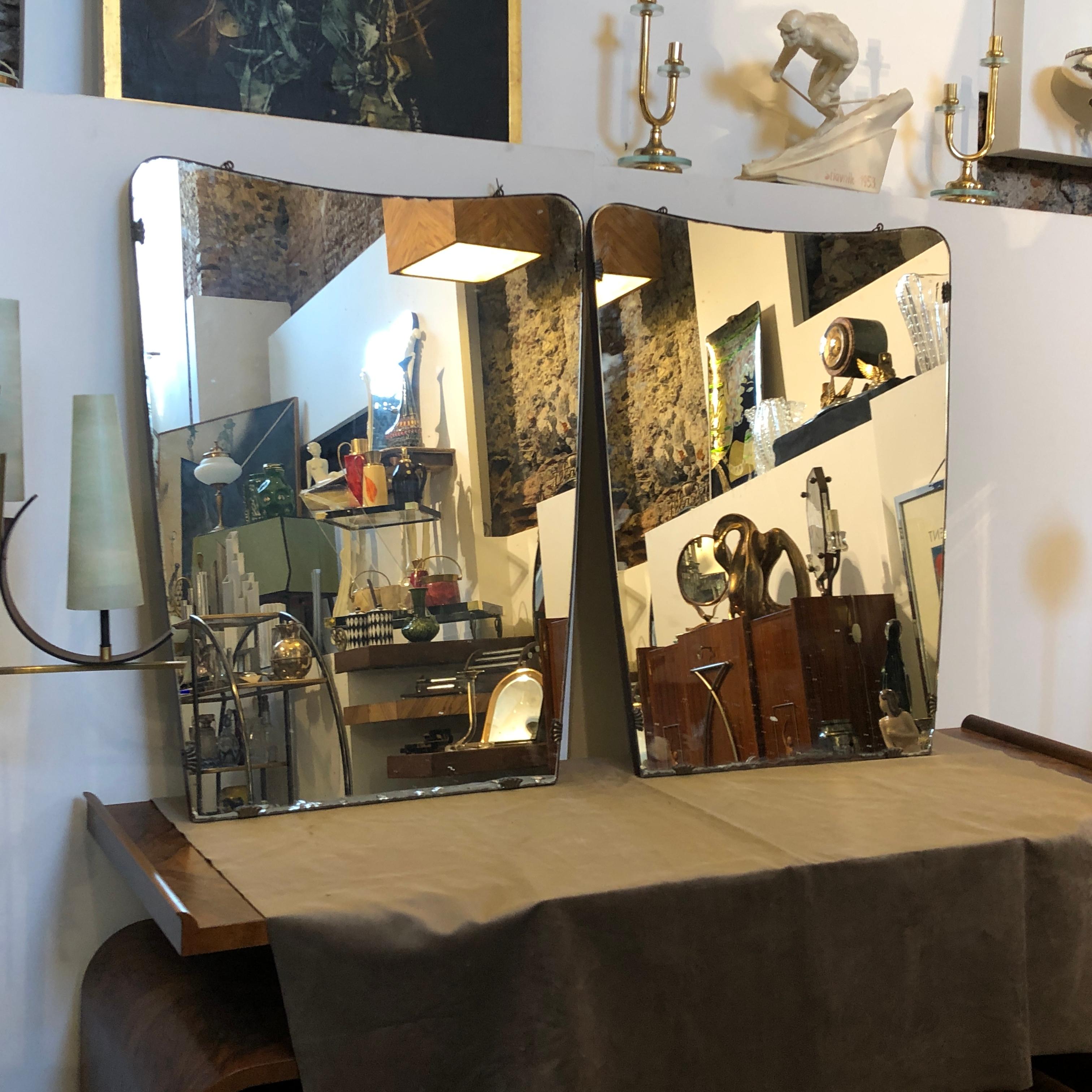Two wood and glass wall mirror made in Italy in the fifties, glasses and wood are in original conditions.
