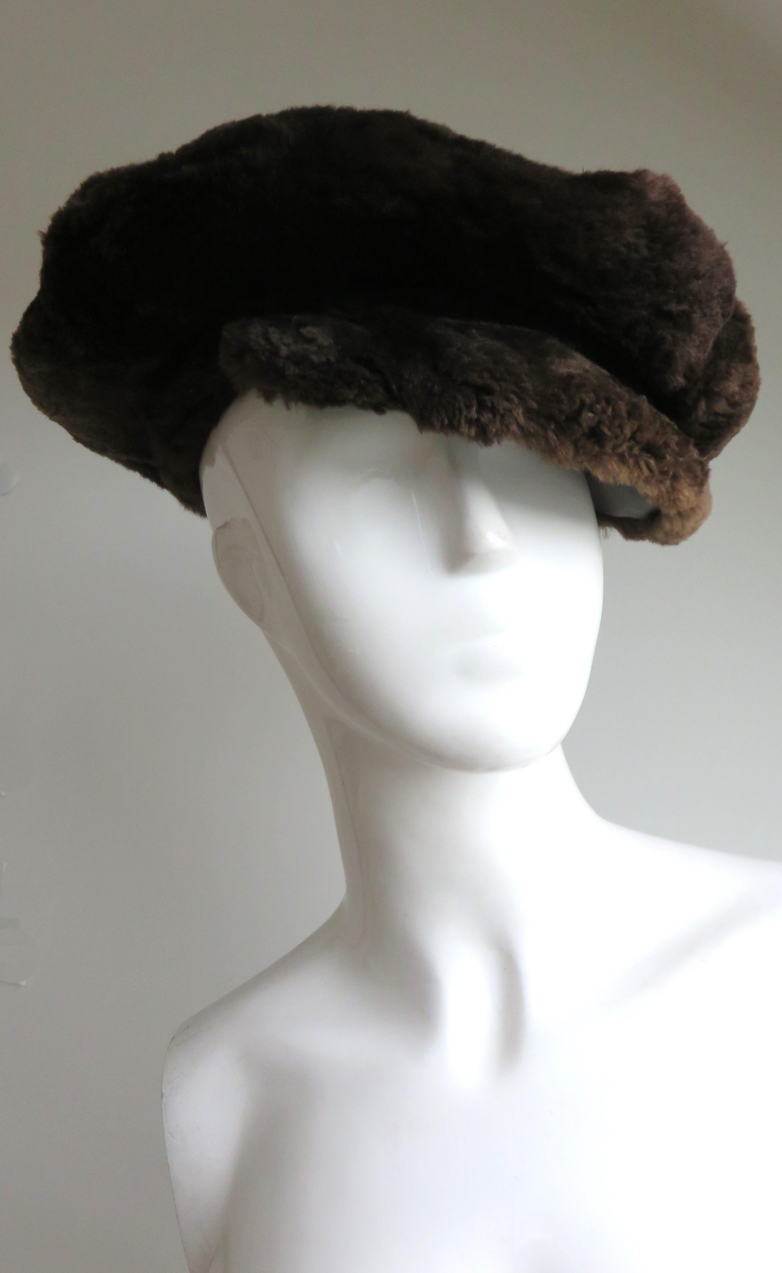 A rich brown 1950s sheared beaver fur newsboy cap. It has a front 2.50
